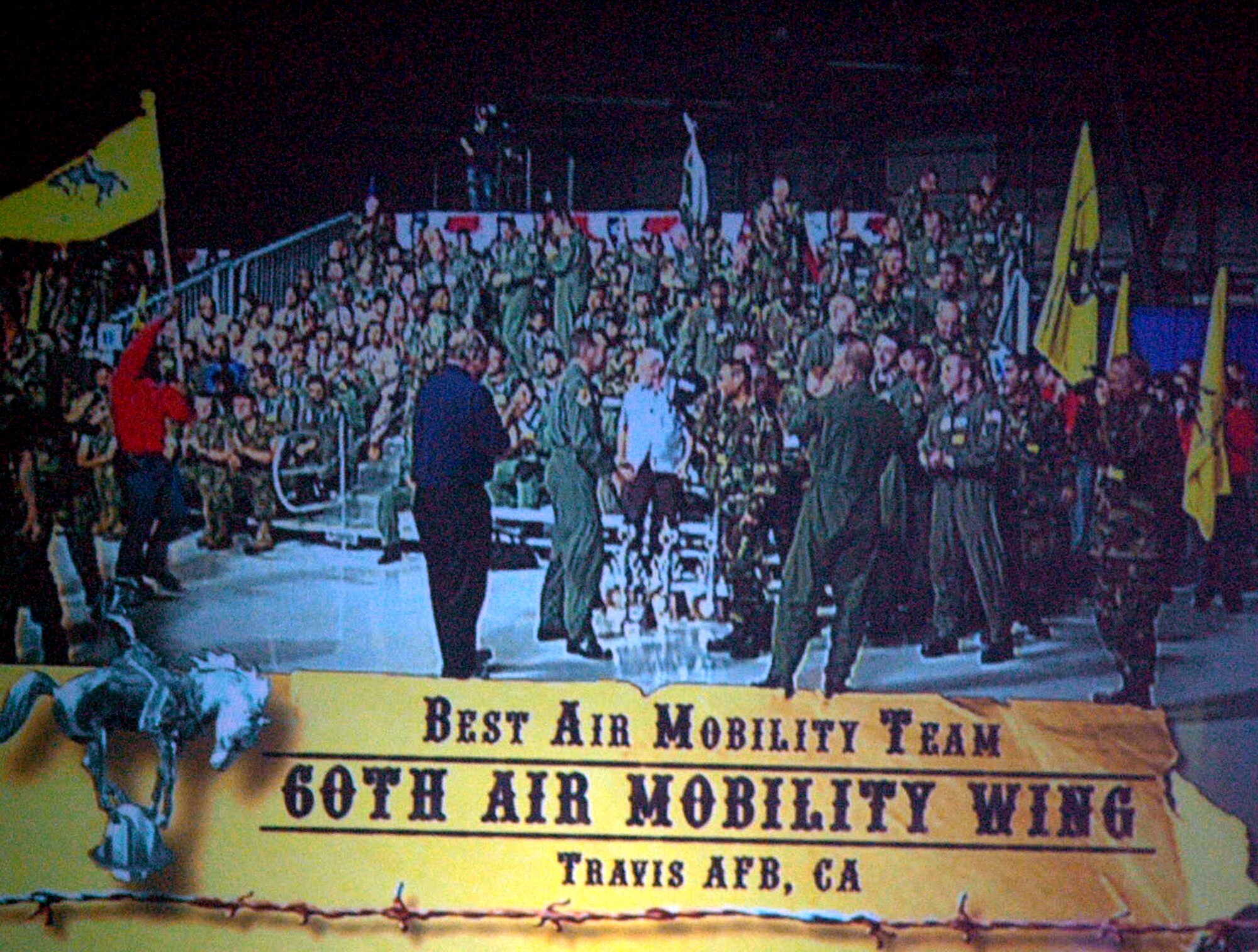 Team members from the 60th Air Mobility Wing, Travis Air Force Base, Calif., celebrate after winning the "Best Air Mobility Team" award at Air Mobility Rodeo 2007 during the closing celebration July 27, 2007.  The award signifies the "best of the best" among all the Rodeo teams.  (U.S. Air Force Photo by Tech. Sgt. Scott T. Sturkol)