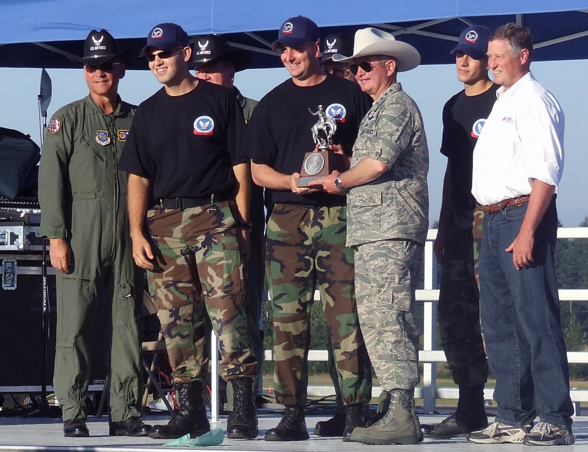 The 305th Air Mobility Wing security forces combat challenge team accepts the "Best Combat Challenge Team" award from Gen. Duncan McNabb, Air Mobility Command commander, during an awards presentation July 26 for Air Mobility Rodeo 2007 at McChord Air Force Base, Wash.  Rodeo, sponsored by Air Mobility Command, is a readiness competition for U.S. and international mobility forces.  (U.S. Air Force Photo by Tech. Sgt. Scott T. Sturkol)