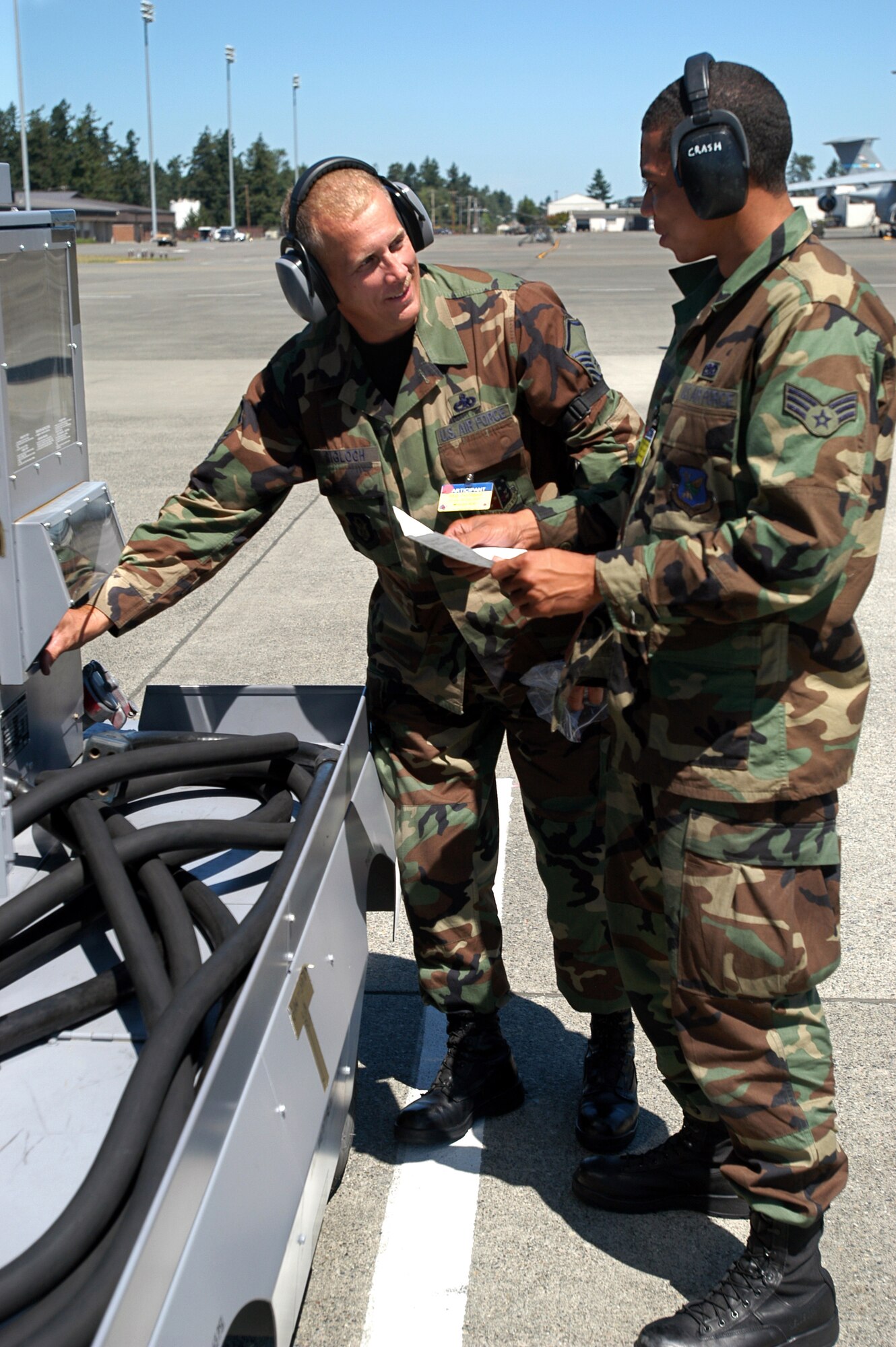 Master Sgt. Paul Sigloch, 514th Air Mobility Wing aircraft overhaul supervisor, and Senior Airman Arjuna Ramcharan, 305th Air Mobility Wing C-17 crewchief, inspect a A/N32-86 diesel generator set, which supplies elecrical power to their C-17 Globemaster III at Air Mobility Rodeo 2007 at McChord Air Force Base, Wash. The two are part of a blended team from McGuire Air Force Base, N.J., made up of both Air Force active-duty and reserve personnel, at the Air Mobility Rodeo 2007. Both McGuire AFB and Charleston AFB, S.C., sent blended teams to Rodeo. Rodeo 2007 is a readiness competition of U.S. and international mobility air forces. It focuses on improving warfighting capabilities and support of the Global War on Terrorism. (U.S. Air Force photo/Staff Sgt. Mark R. W. Orders-Woempner)