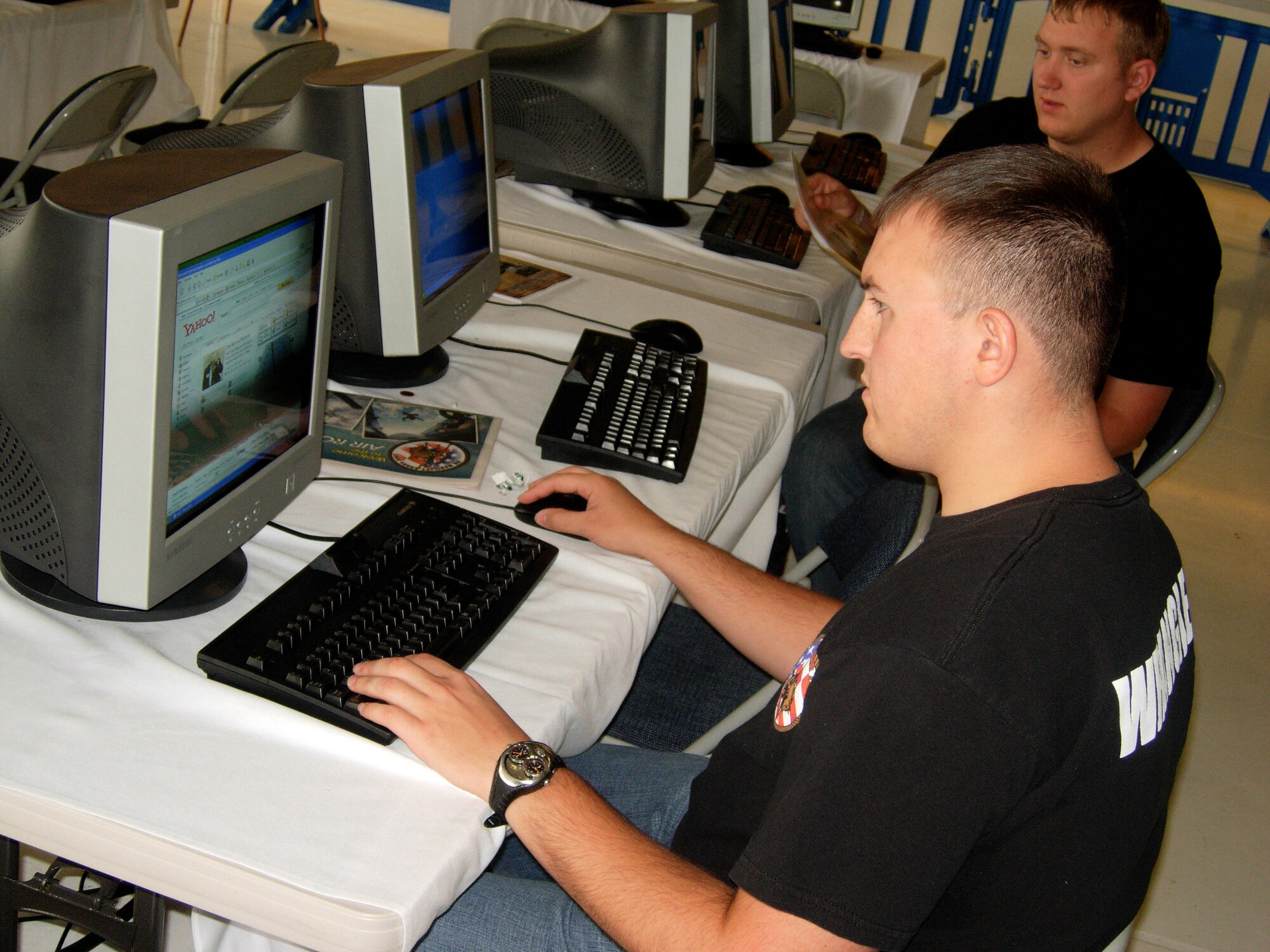 Senior Airman Joshua Sims, Air Mobility Rodeo 2007 support staff member, takes advantage of the Internet cafe provided by the Rodeo Communications team. Rodeo, sponsored by Air Mobility Command, is a readiness competition between U.S. and international mobility air forces. (U.S. Air Force photo/Staff Sgt. Amaani Lyle) 