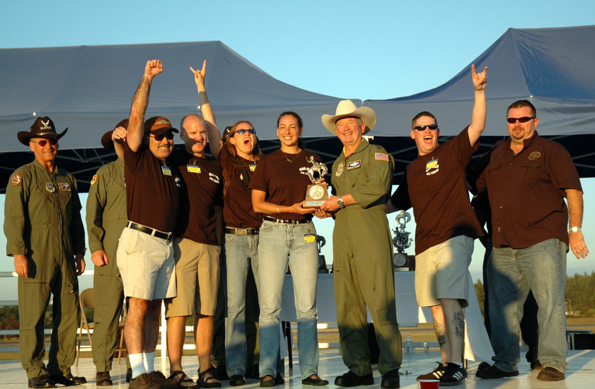 Reservists from McChord's 446th Aeromedical Evacuation Squadron receive the best aeromedical evacuation team award at the Air Mobility Command's Rodeo 2007. The five-member team showed off its skills July 23- 25 in static configurations on both a KC-135 and C-17, a contingency flight, and a challenge course to win the award. (U.S. Air Force photo/Senior Airman Desiree Kiliz)