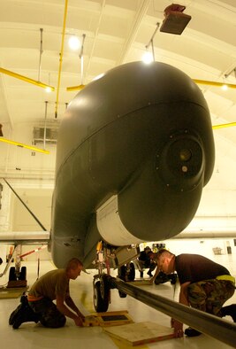 Airman deployed from Beale Air Force Base, Calif., prepare to weigh the Global Hawk before refueling in a hangar July 19 at Andersen Air Force Base, Guam. The aircraft has a wing span of 116 feet and is designed to cruise at extremely high altitudes. This marked the first time a Global Hawk deployed in support from the 9th Reconnaissance Wing at Beale Air Force Base, Calif. (U.S. Air Force photo/Senior Airman Miranda Moorer)                     