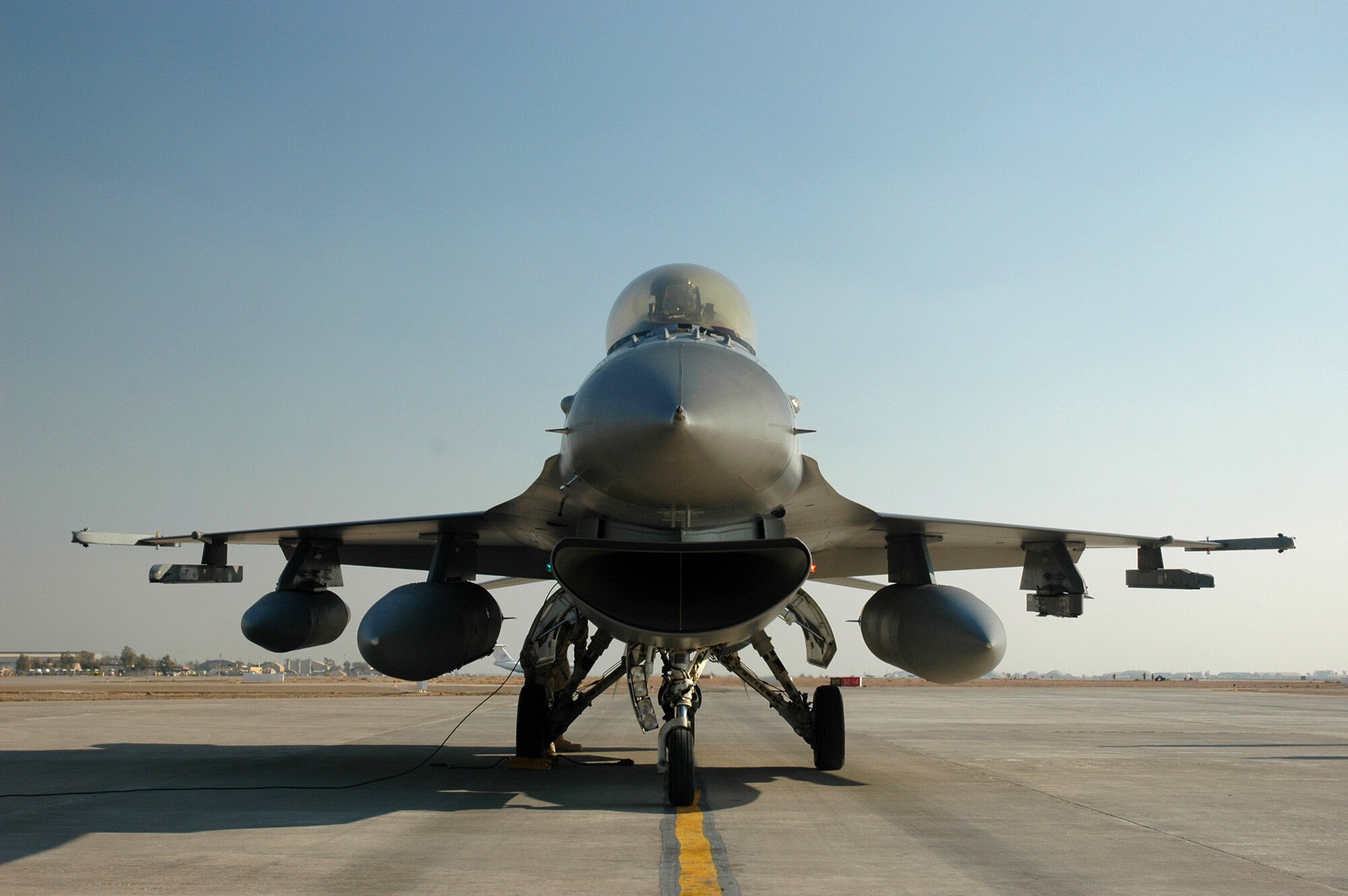 An Air Force F-16 Fighting Falcon sits on the flightline at Balad Air Base, Iraq.  F-16s fly close-air-support missions for Operation Iraqi Freedom.  There were 49 CAS missions flown by coalition aircraft for OIF July 26.  (U.S. Air Force photo.)