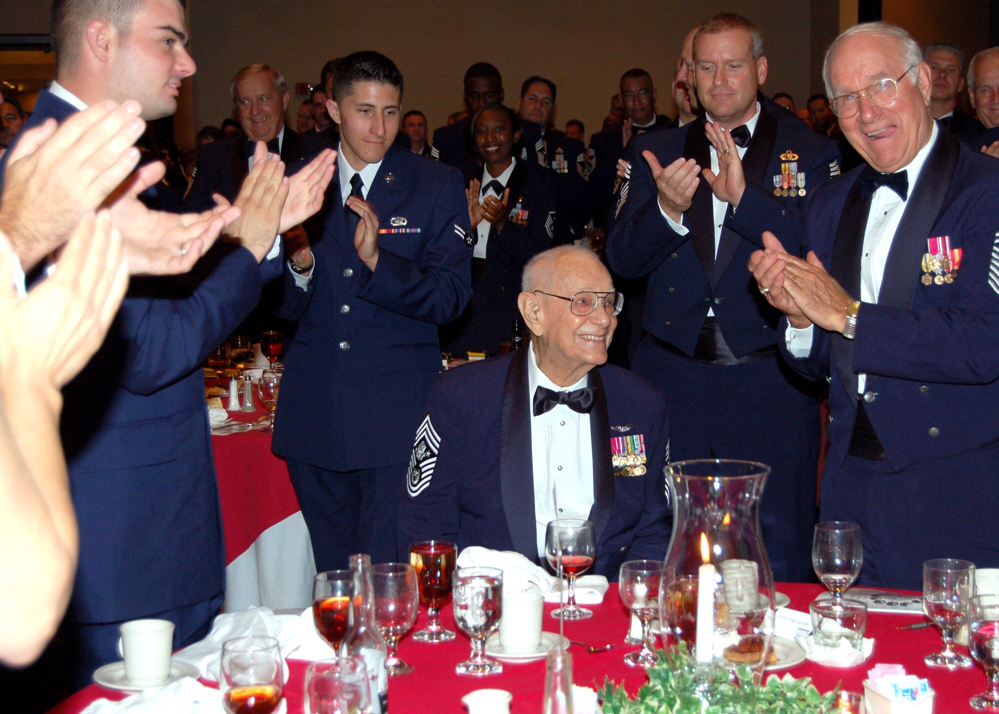 The first Chief Master Sgt. of the Air Force Paul Wesley Airey gets a standing ovation during the Senior Enlisted Leaders Conference Heritage Dinner July 26 in Montgomery, Ala. (U.S. Air Force photo/Master Sgt. Lee Roberts) 