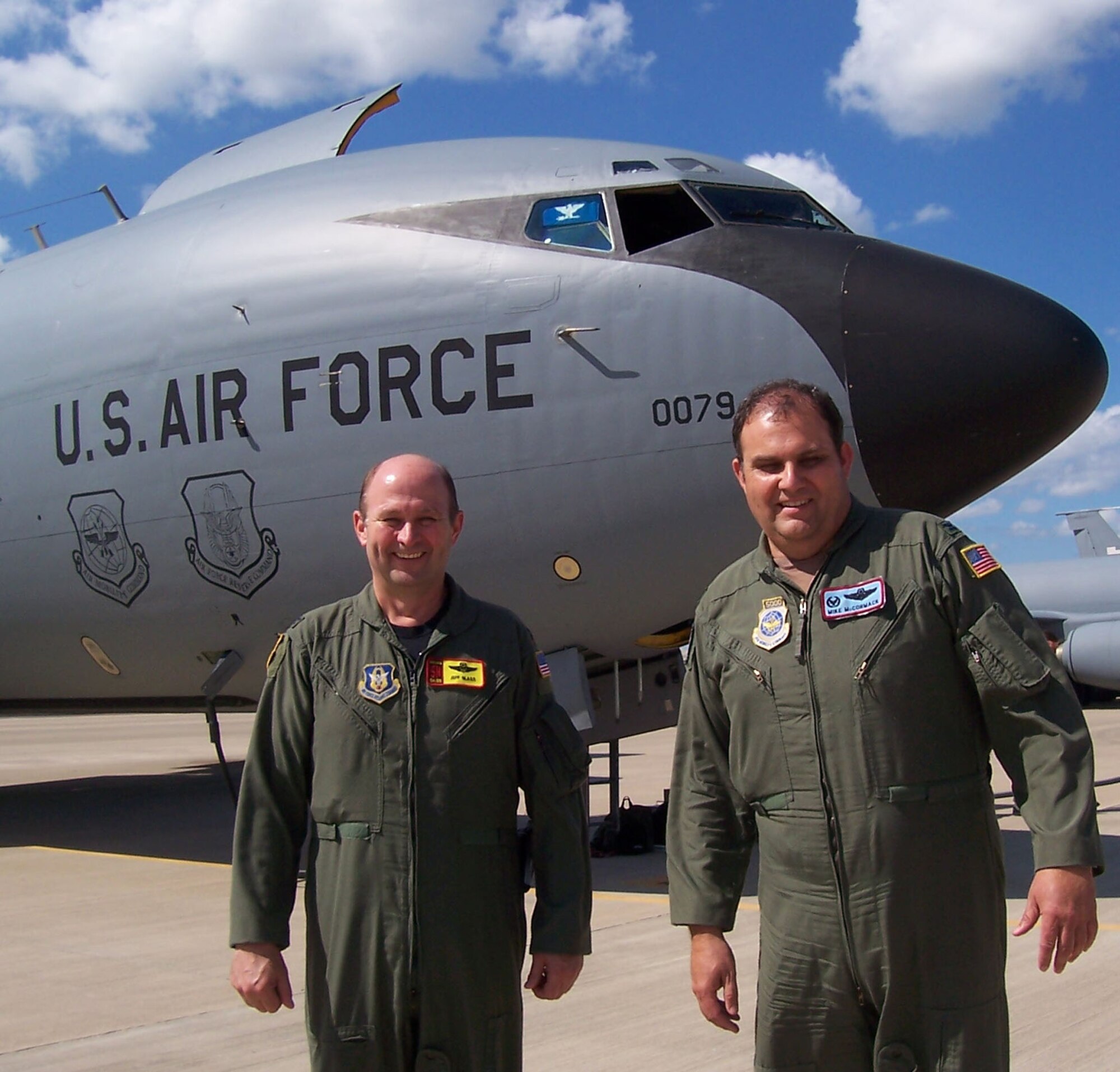 Col. Jeffery R. Glass, 507th Air Refueling Wing commander, and Col. James McCormack, 137th Airlift Wing commander, pause a moment on the flight line prior to their first duo commander mission.  Colonel McCormack's Air National Guard wing is slated to stand up as a KC-135R associate wing affiliated with Colonel Glass's Air Force Reserve Command wing in late 2007. The merger is the first time an Air National Guard wing has associated to an Air Force Reserve wing.