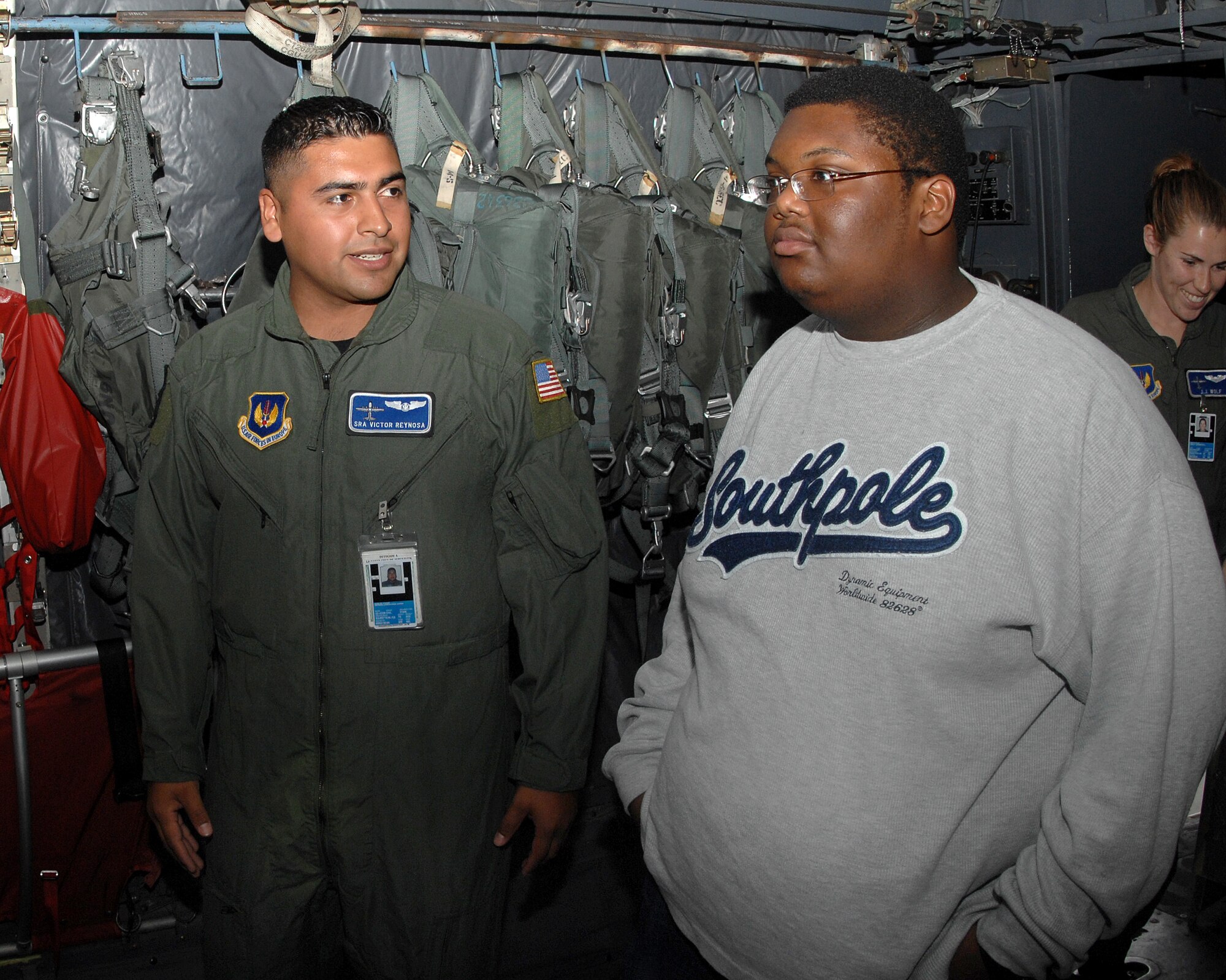 Senior Airman Victor Reynos, 37th Airlift Squadron, shows Jordan Perry all the ins and outs of a C-130 July 21, 2007.  Jordan, who recently beat cancer, had a wish to visit Ramstein Air Base. Jordan's dad, Lester Perry, a retired Army first sergeant, was stationed in Germany in the early 90's. Ramstein Air Base personnel from different squadrons and the Dreams Come True foundation pulled together to make Jordan's dream a reality. (U.S. Air Force Photo/Airman 1st Class Kenny Holston)