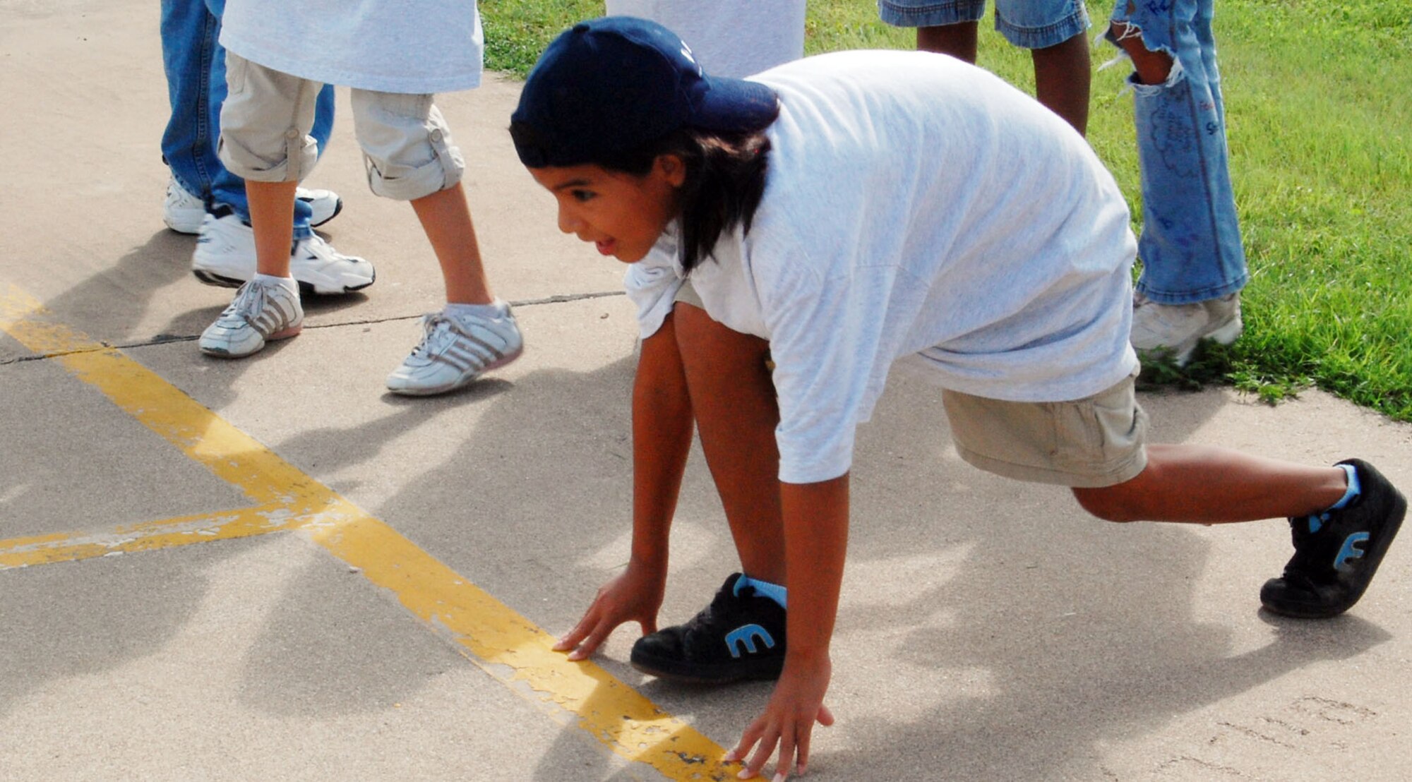 LAUGHLIN AIR FORCE BASE, Texas -- Jasett Martinez, daughter of of 2nd Lt. Cheyne DeWolfe, 84th Flying Training Squadron, and Ana DeWolfe, prepares to start running to test her speed and endurance during the "President's Challenge" for the Drug Education For Youth summer program July 25 The President's Challenge is a program DEFY holds every year to test the members' physical abilities such as running, stretching and push-ups. (U.S. Air Force photo by Airman Sara Csurilla)