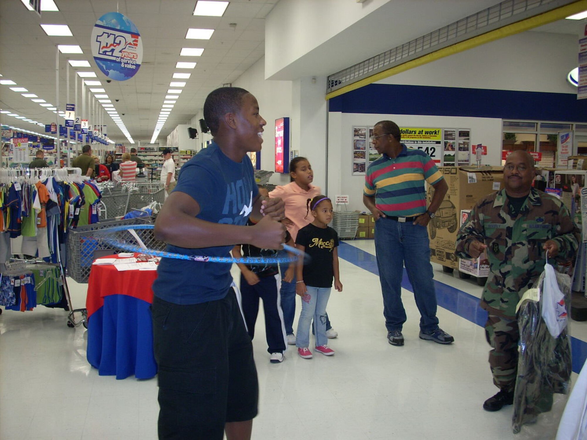 L.D. Dawn, son of Senior Master Sgt. Laraine Warren-Dawn, superintendent of the 917th Services Flight, competes in a hula hoop contest at the base exchange Wednesday, July 25. The contest was one activity held for the 112th birthday celebration of the base exchange program. L.D. won the contest. (U.S. Air Force courtesy photo)