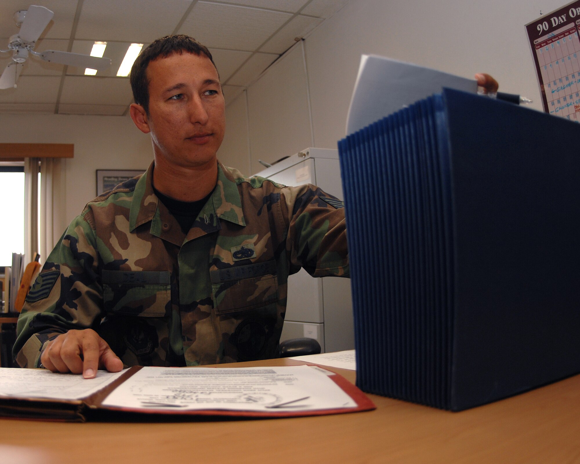 Tech. Sgt. Chris Deal, 86th Maintenance Operations Squadron, looks through jacket files containing the history of different aircraft July 19 at Ramstein Air Base Germany. The jacket files must be reviewed before aircraft can be retired and sent to the aircraft maintenance and regeneration Center  most commonly known as the bone yard. Jacket files are also consulted quarterly to insure all aircraft have there correct and updated credentials. (U.S. Air Force Photo/A1C Kenny Holston)