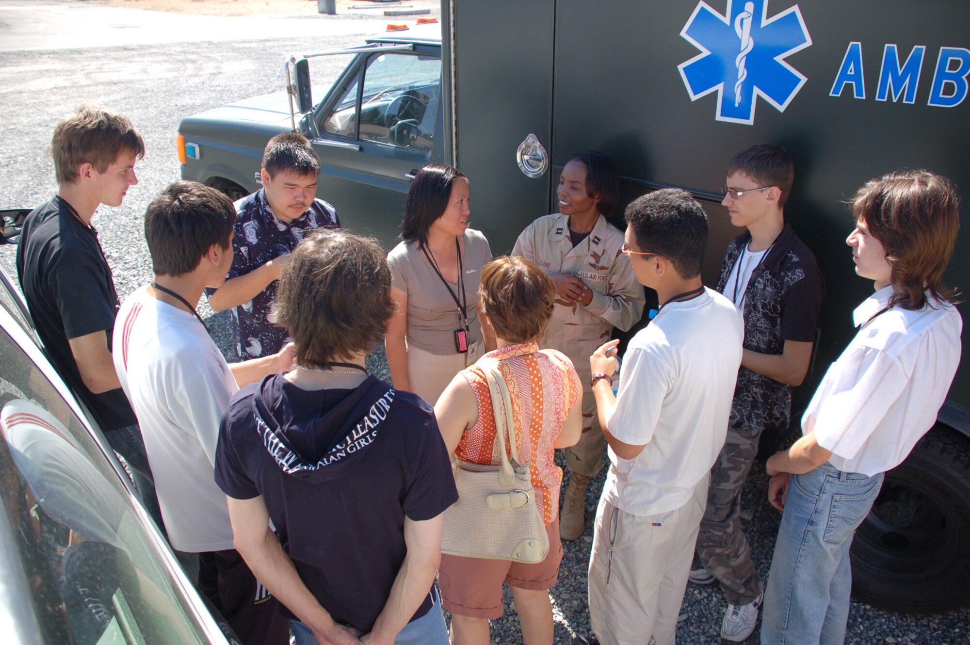 MANAS AIR BASE -- Capt. Sarah Evans, 376th Expeditionary Medical Group nurse, talks with Kyrgyz students from a local medical lyceum.  The students, ranging from 17-19 years of age toured the base to see how American and coalition forces are organized and equipped to handle medical situations here. Captain Evans, deployed from Spangdahlem Air Base, showed the students the patient care areas, dental office and operating room that make up the medical tent and trailer complex. (U.S. Air Force photo/Staff Sgt. Lesley Waters)