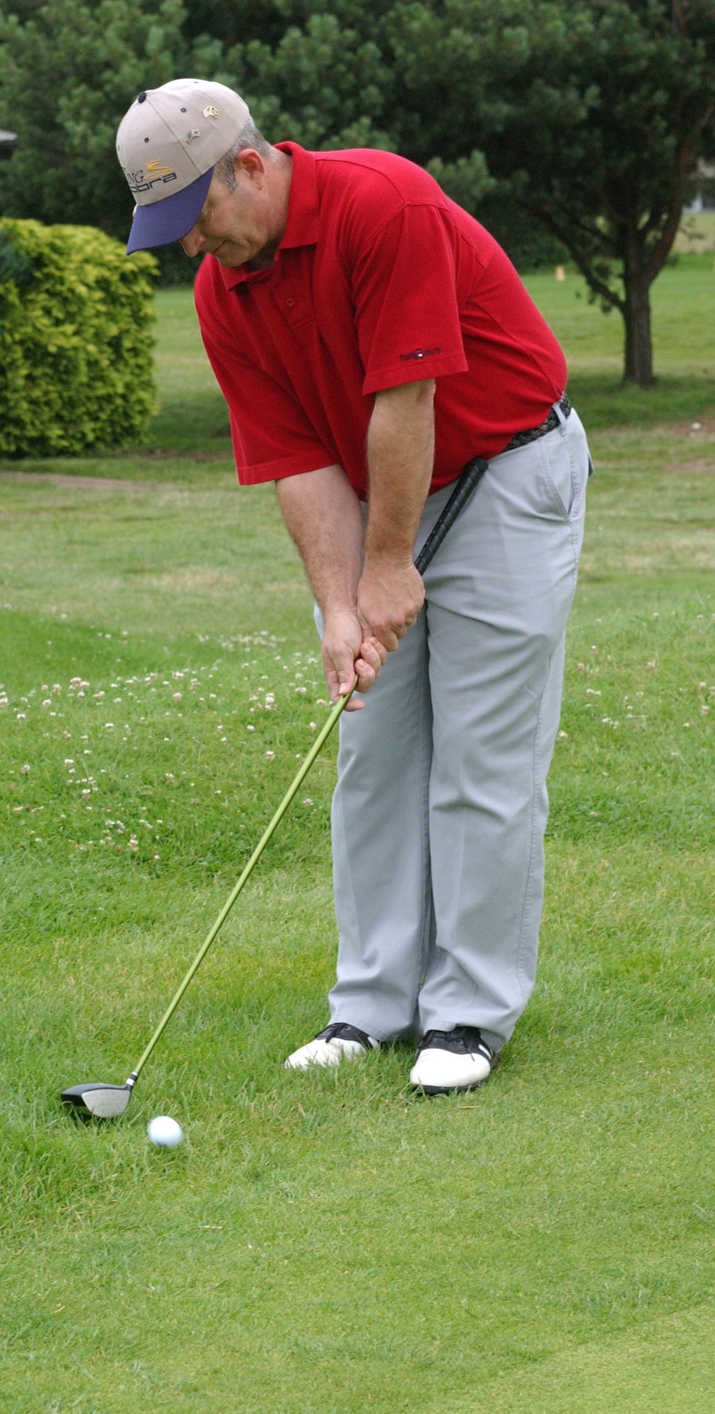 Master Sgt. Kevin Hawks 100th Maintenance Squadron First seargeant chips the ball with a three wood onto the putting green during the RAF Mildenhall Airman Commited to Excelence golf tournament July 13 at  Breckland Pines Golf Course.(U.S Air Force photo by Airman Brad Smith)