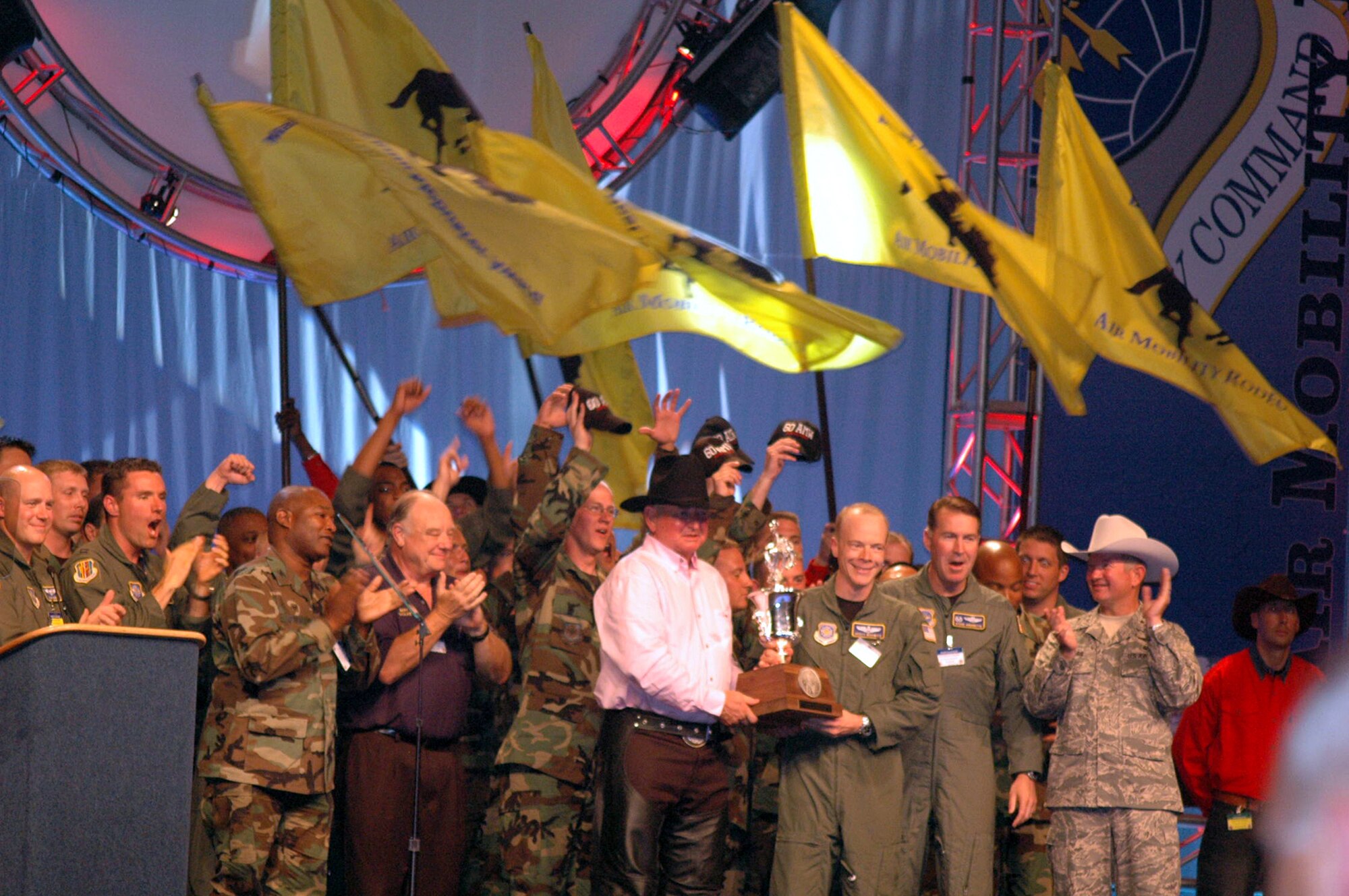 Team members from the 60th Air Mobility Wing at Travis Air Force Base, Calif., celebrate after winning the "Best Air Mobility Team" award at Air Mobility Rodeo 2007 during the closing celebration July 27.  The award signifies the "best of the best" among all the Rodeo teams. (U.S. Air Force photo/Tech. Sgt. Scott T. Sturkol)