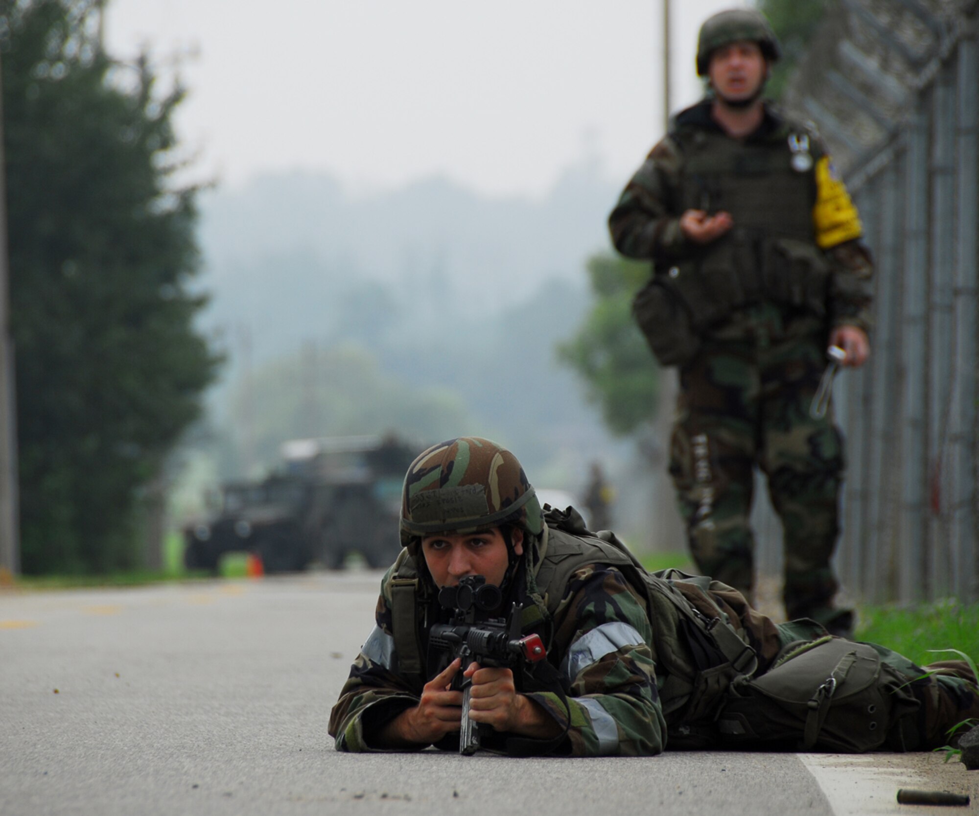OSAN AIR BASE, Republic of Korea -- A member of the 51st Security Forces defends the base from opposing forces during the Beverly Bulldog 07-03 exercise here on July 26, 2007. The exercise Beverly Bulldog 07-03 scenarios test Team Osan's ability to defend the base and conduct daily operations in a combat environment. (U.S. Air Force photo by Airman 1st Class Chad Strohmeyer)