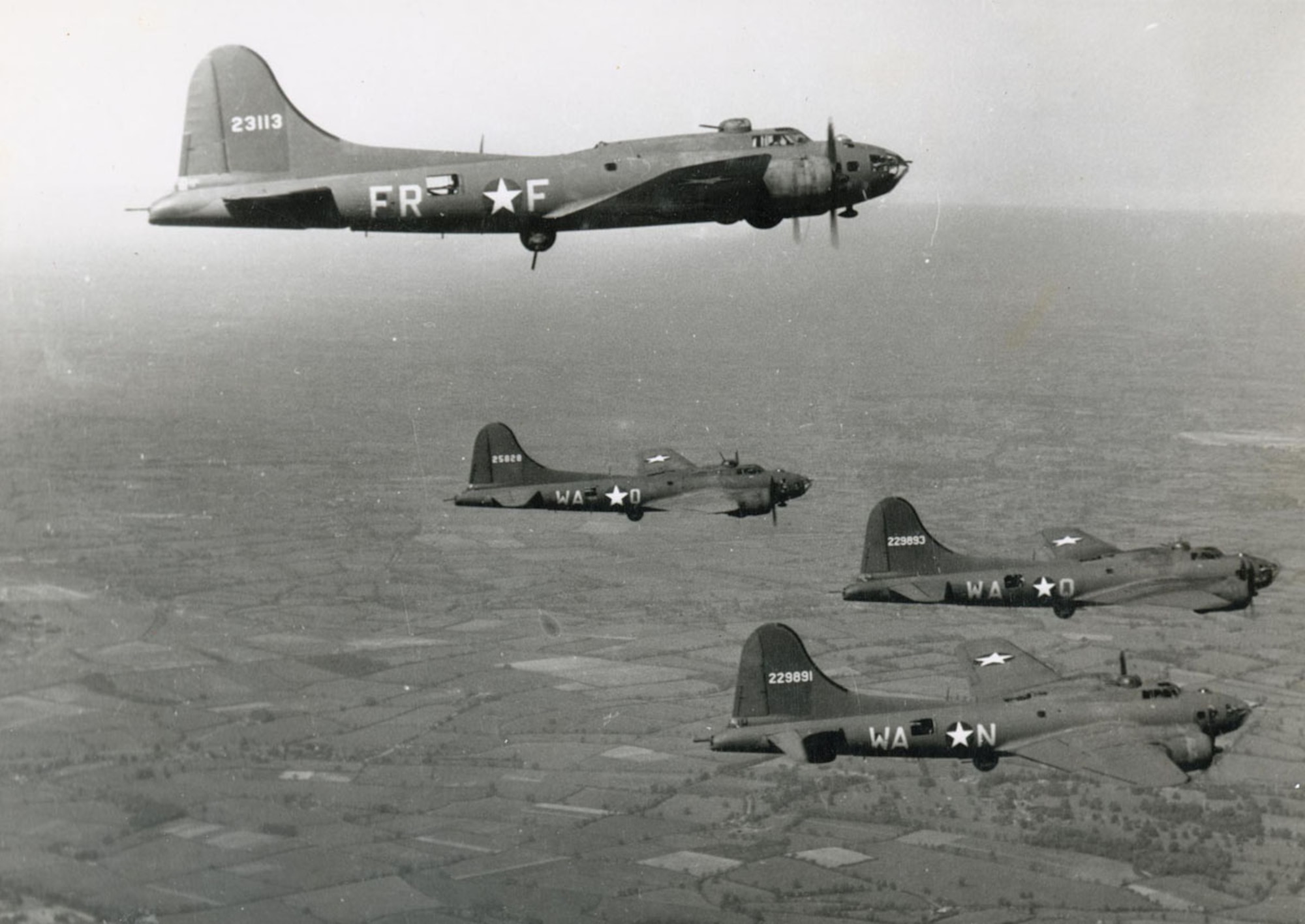 A formation of B-17 Flying Fortresses from the 379th Bombardment Group (Heavy), 524th and 525th Bombardment Squadrons fly over Europe.  The 379th BG was presented with the “Grand Slam” award by 8th Air  Force, for placing first in every evaluated phase of bombing, including best bombing results, greatest tonnage of bombs dropped and lowest losses of aircraft. (U.S. Air Force photo)