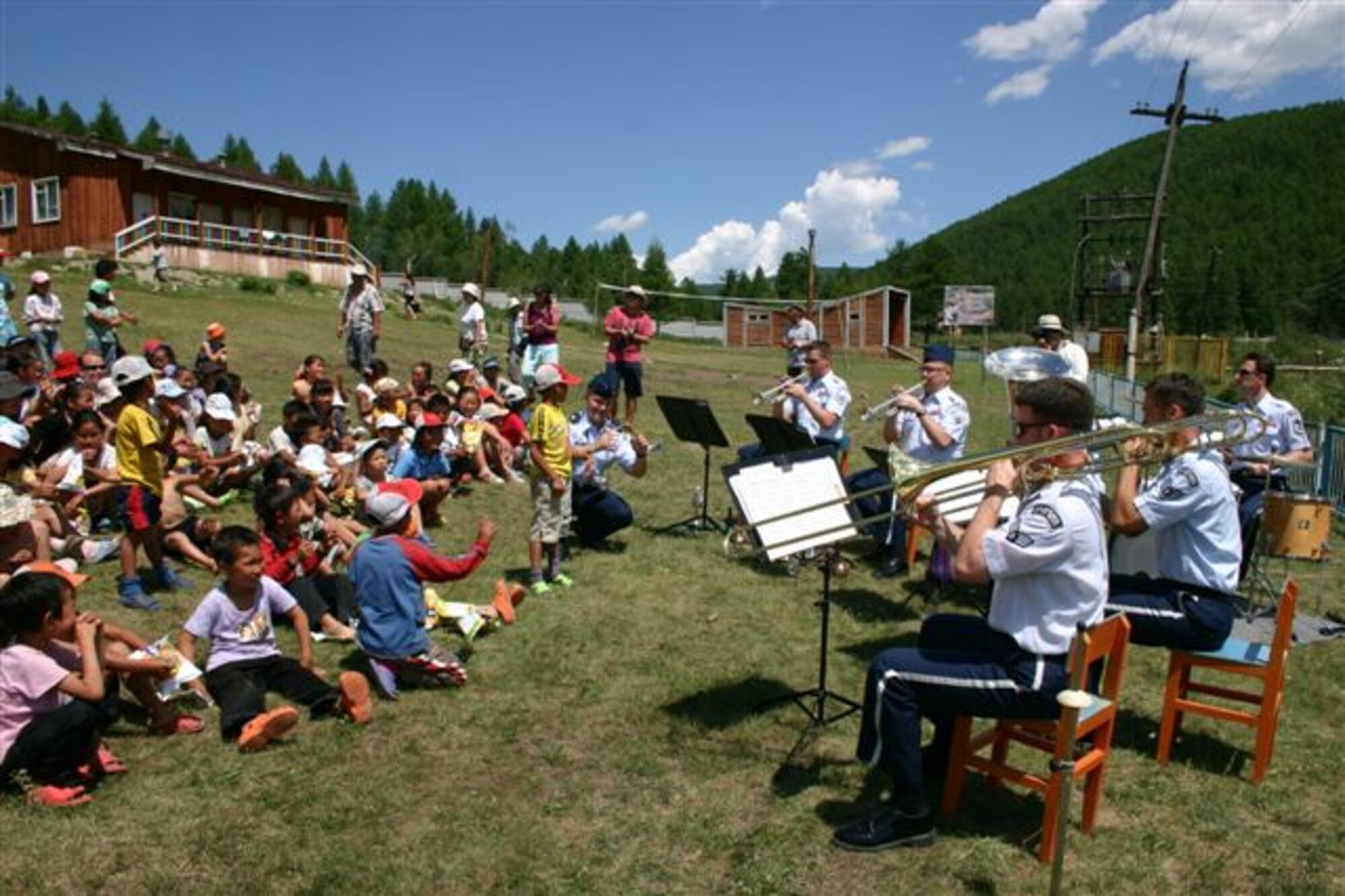 Pacific Brass performs outside for an excited Mongolian village.  For many of the Mongolians, this was the first time they came in contact with Americans.