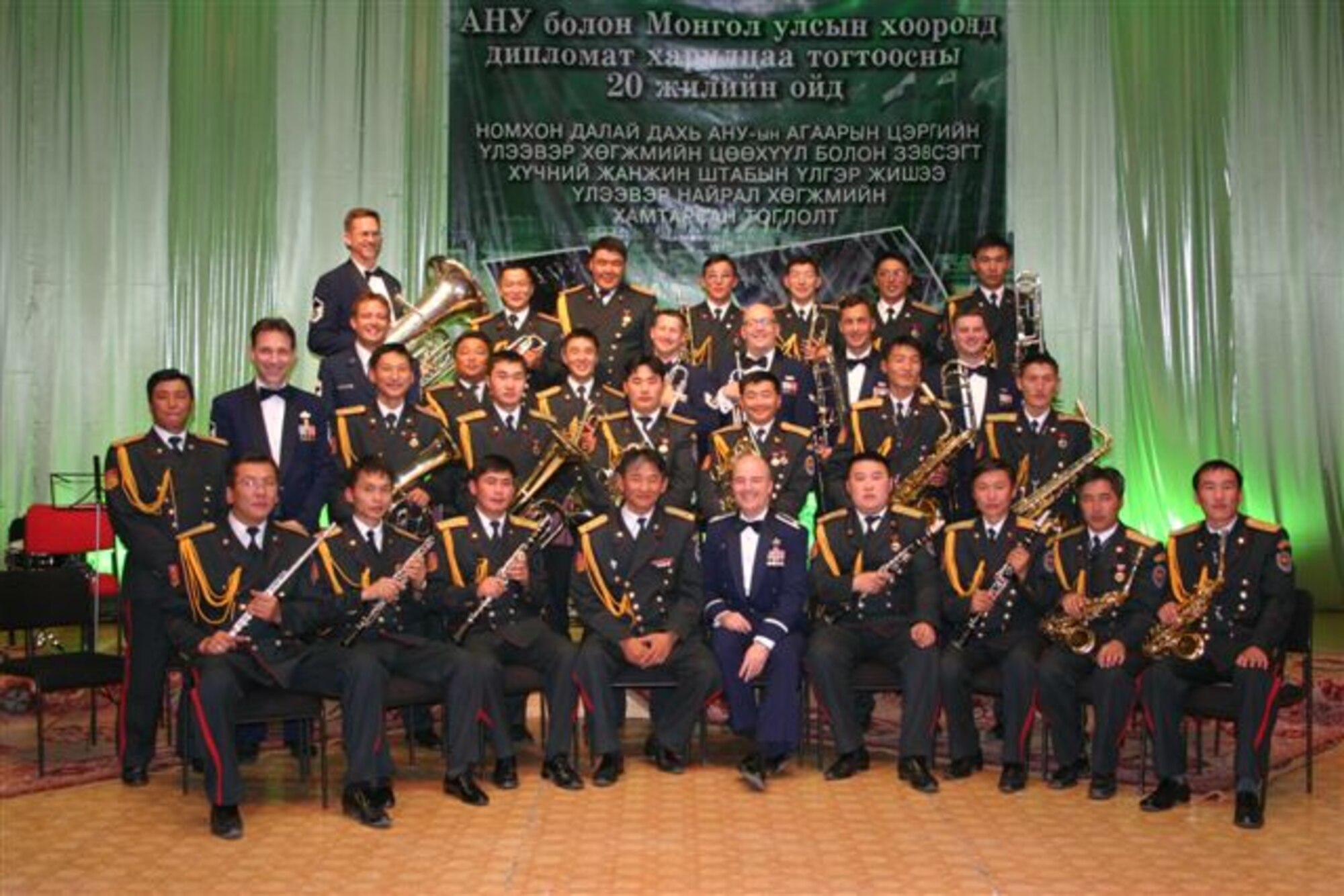 Major Matt Henry and Pacific Brass pose with members of the Mongolian Armed Forces Band.