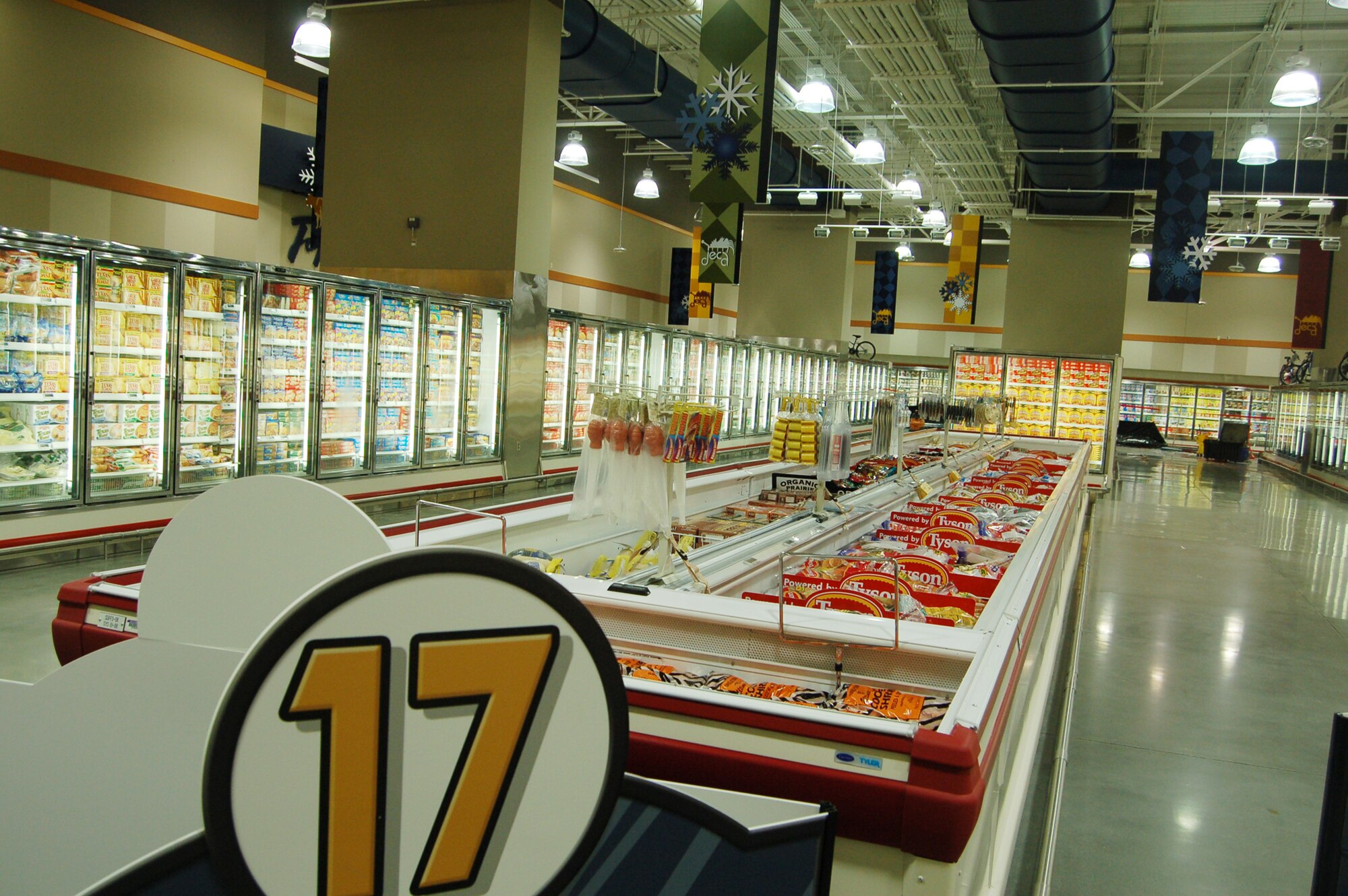 Peterson's new commissary features wider aisles and a larger selection of products, including rotisserie chicken and an assortment of exotic items, such as rattlesnake and ice cream bars from the Philippines. Other amenities include self checkouts, electronic price tags and a sushi bar. The new store will be the second largest commissary in the world, second only to a store in San Diego. Peterson's new commissary opens at 9 a.m. Aug. 3 at Pete East; the old commissary is closed Aug. 2 for the move. (U.S. Air Force photo by Corey Dahl)