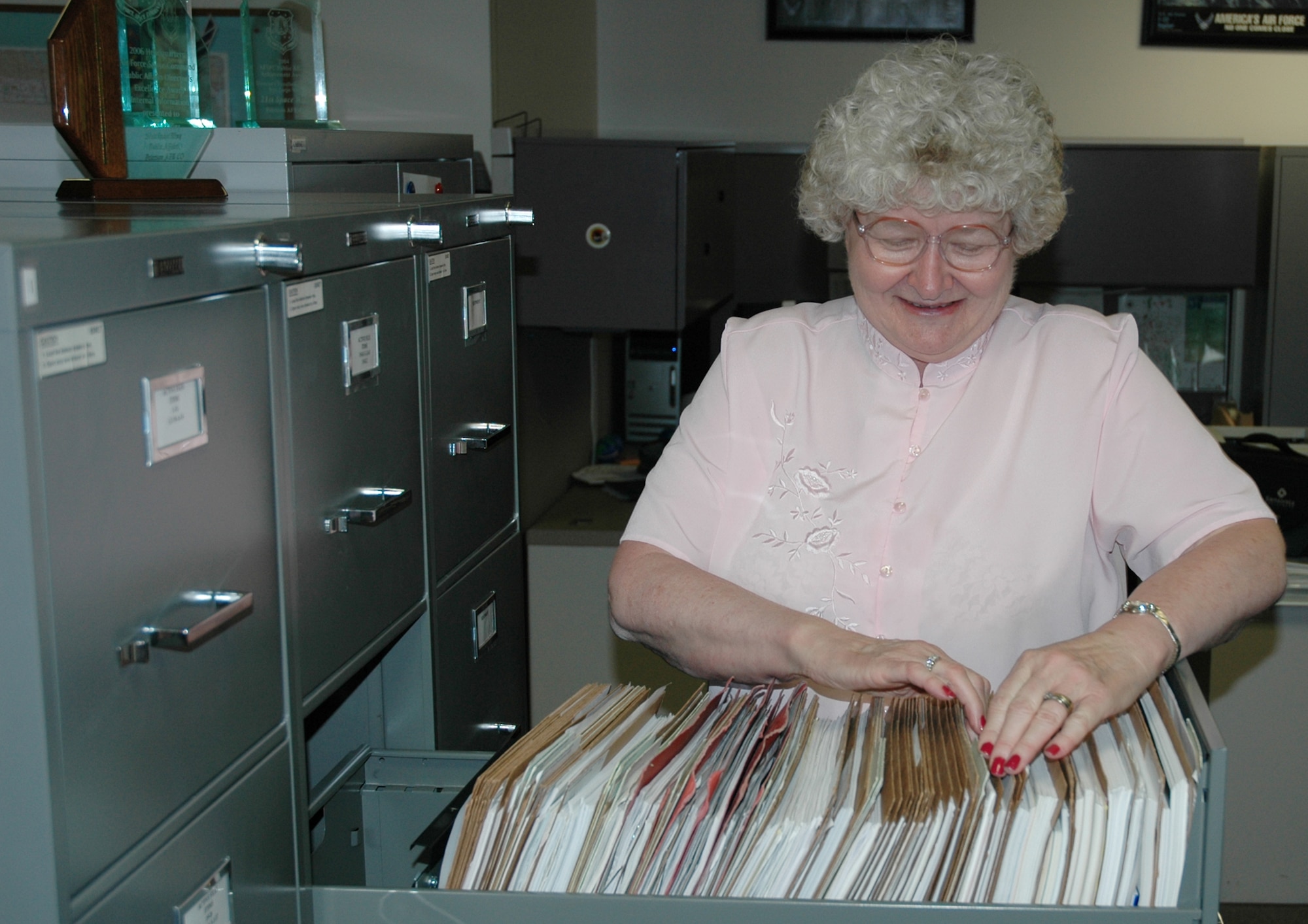Margaret Leibfried has been an administrative support assistant and office manager for the 21st Space Wing Public Affairs Office for 23 years. During that time, she has won numerous awards, including an AFSPC Inspector General Professional Performer Award for her filing system. (U.S. Air Force photo by Steve Brady)