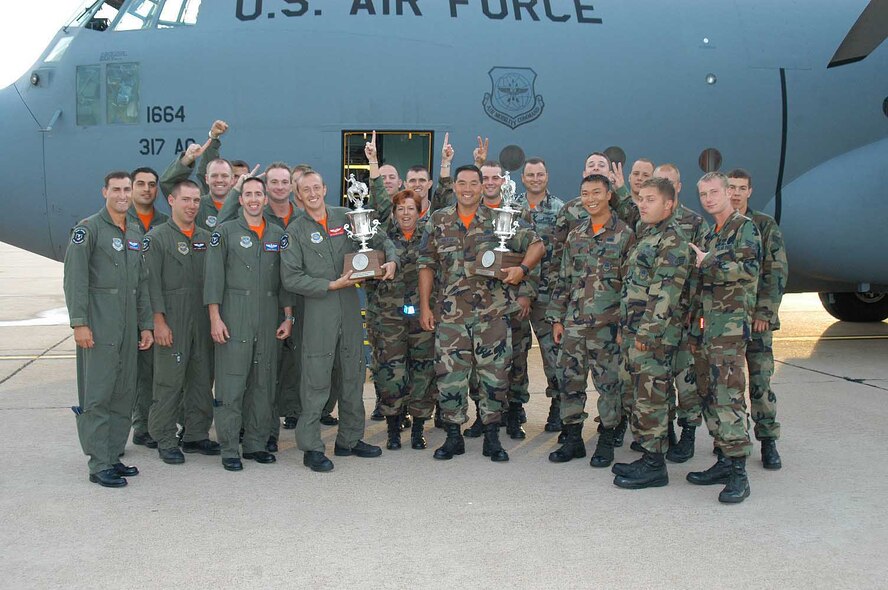 The 22 Airmen who attended the 2007 Air Mobility Command Rodeo at McChord Air Force Base, Wash., celebrate winning two worldwide awards: for best C-130/C-160 and best C-130/C-17 airdrop. (U.S. Air Force photo/Senior Airman Carolyn Viss)
