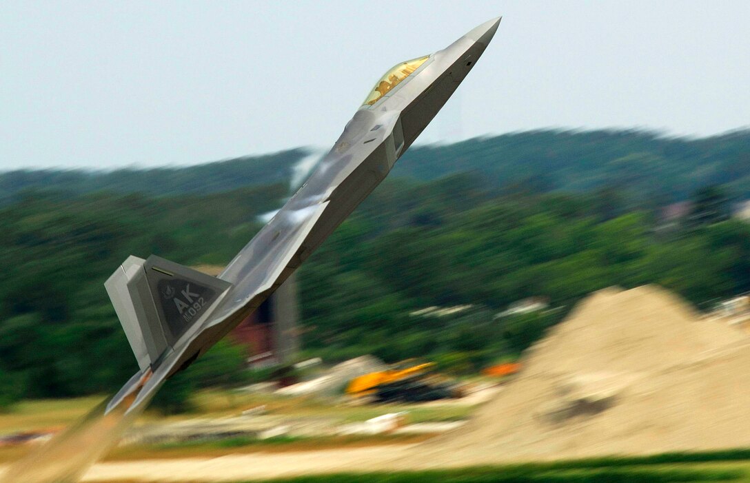 Maj. Paul "Max" Moga, the first F-22A Raptor Demonstration Team Pilot, does a max climb seconds after aircraft takeoff during an aircraft demonstration July 13. (U. S. Air Force photo/Staff Sgt. Samuel Rogers)
