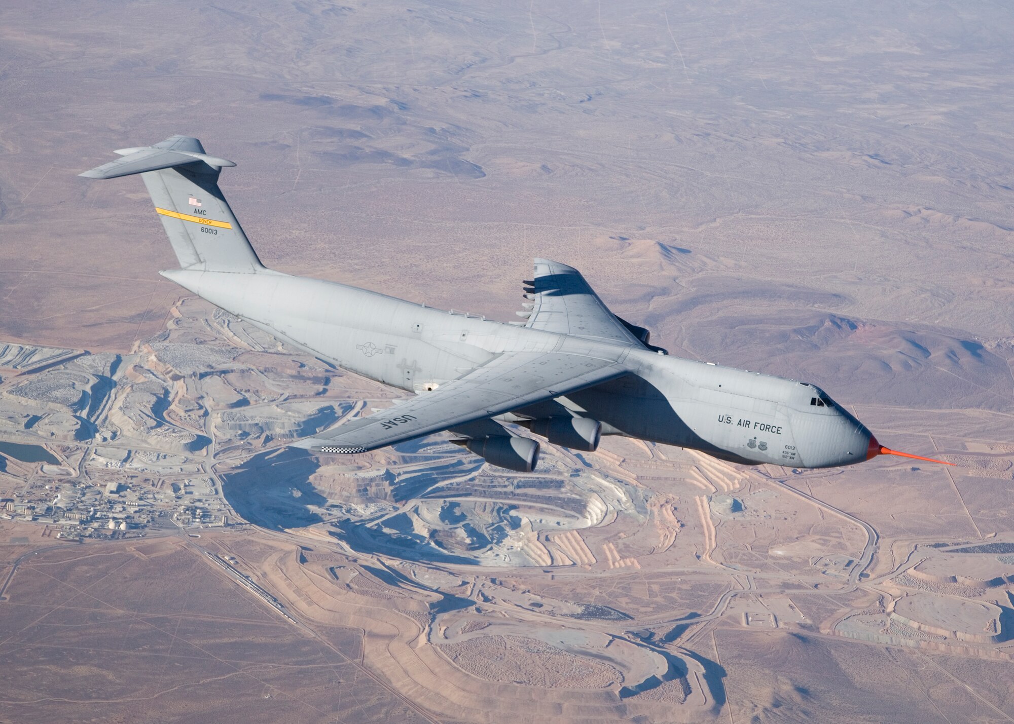 A C-5M flies over the Mojave Desert during flight testing Feb. 26. The Combined Test Force for the C-5 modernization program concluded its most recent series of testing July 23. Two C-5M's are scheduled to return to Edwards at the end of August to conduct minimum control ground speed and field performance data tests. (Photo by Bobbi Zapka)
