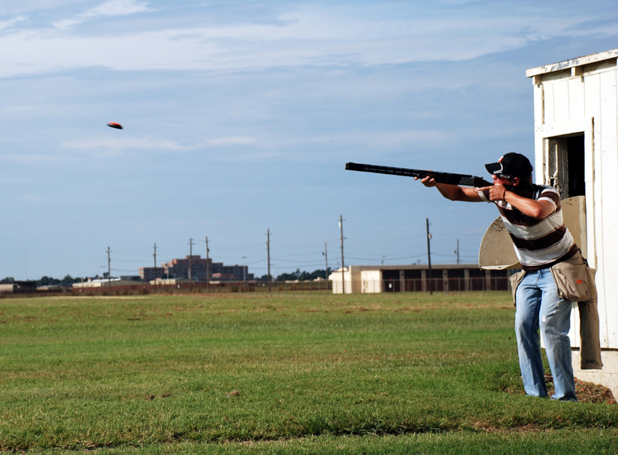 Jake Hukill takes aim at the National Skeet Shooting Association Tournament at the base shooting range July 28. Bryan Davis, 15-year-old son of Lt. Col. Rick Davis, 88th Flying Training Squadron commander, placed first in the 12 gauge, 20 gauge, 28 gauge and .410 bore class shoots, as well as winning the overall event. The event featured 16 shooters from both Texas and Oklahoma, and was the first of its type held at Sheppard in five years. (U.S. Air Force photo/Airman 1st Class Jacob Corbin) 