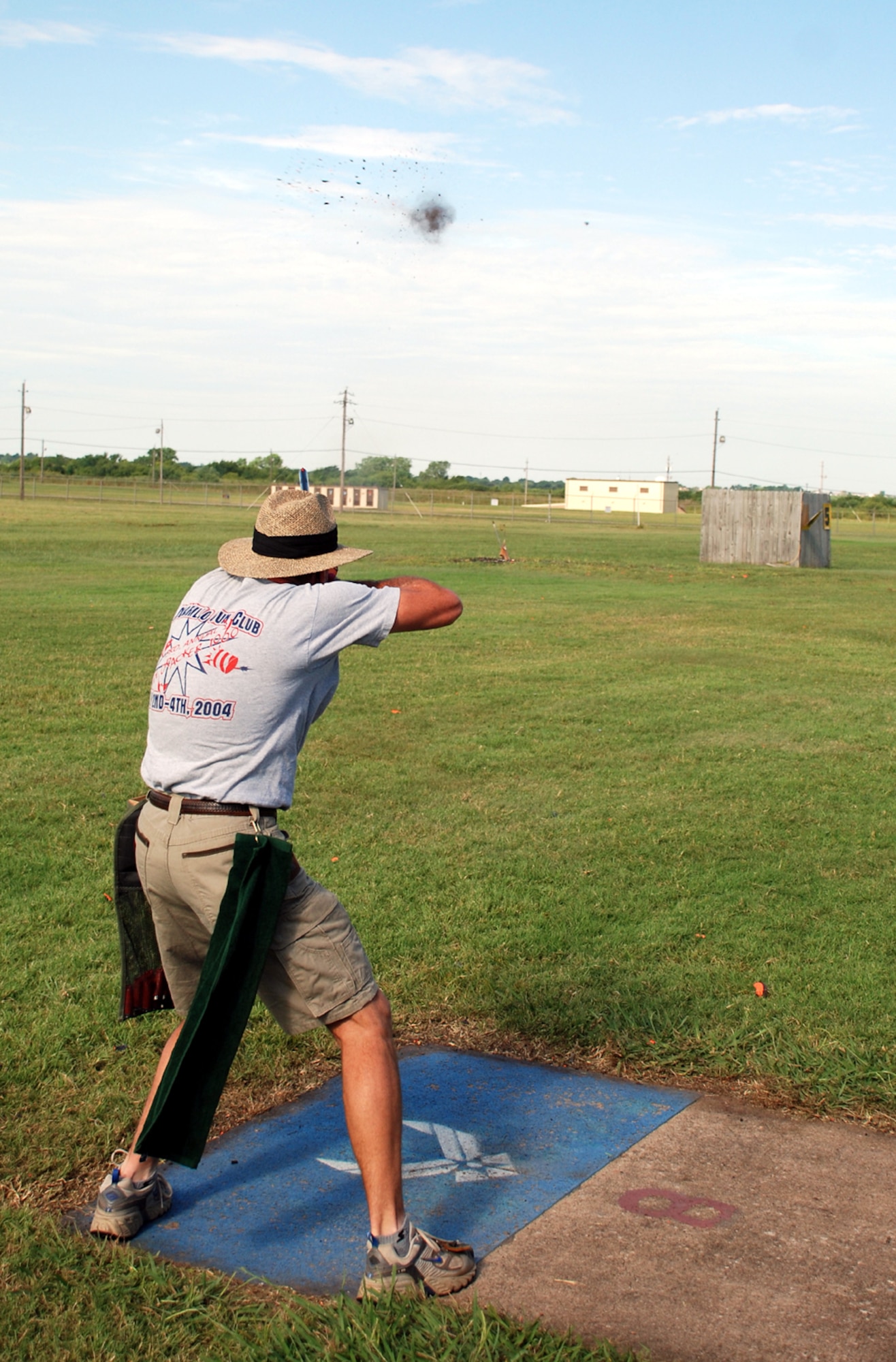 Greg Petty hits his target at the National Skeet Shooting Association Tournament at the base shooting range July 28. Bryan Davis, 15-year-old son of Lt. Col. Rick Davis, 88th Flying Training Squadron commander, placed first in the 12 gauge, 20 gauge, 28 gauge and .410 bore class shoots, as well as winning the overall event. The event featured 16 shooters from both Texas and Oklahoma, and was the first of its type held at Sheppard in five years. (U.S. Air Force photo/Airman 1st Class Jacob Corbin) 