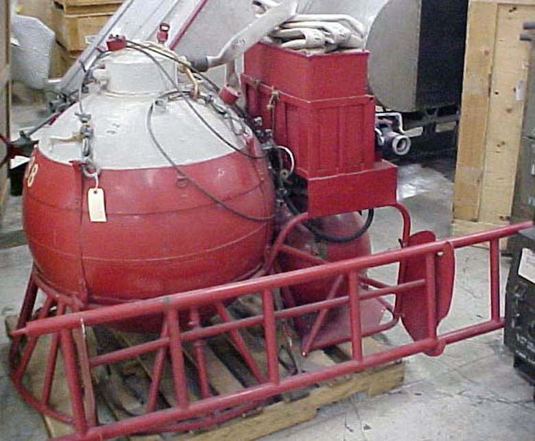 This 1,000-pound kit was developed at Wright-Patterson Air Force Base, Ohio, to provide quick aid in fighting aircraft crash fires. The tank contained 83 gallons of water and foam, but when this mixture reached the air at the nozzle, it expanded to more than eight times its volume to produce about 690 gallons of fire-fighting foam. The kit could be picked up from its trailer in a cargo sling by an HH-43 crash-rescue helicopter and lifted to the fire site. A heater was mounted on the trailer to prevent the tank contents from freezing when on "ready alert" status at an airbase in cold weather. (U.S. Air Force photo)