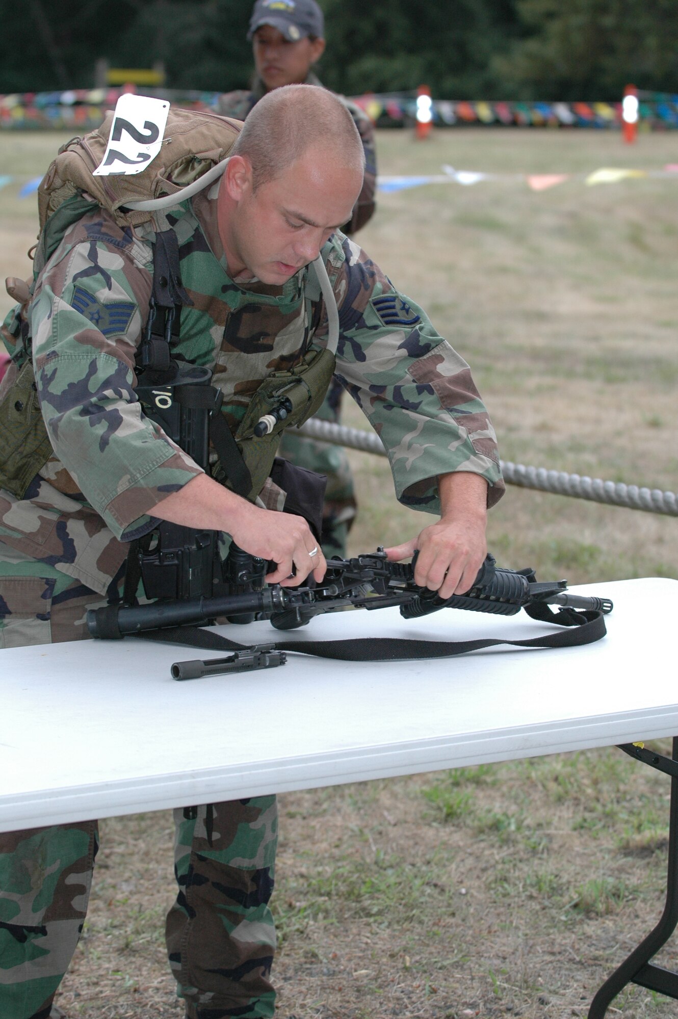 Staff Sgt. William Lannon, 570th Global Mobility Readiness Squadron, assembles a weapon during the first part of the combat challenge course July 26 at McChord Air Force Base, Wash. (U.S. Air Force photo/Airman 1st Class Kristen Rohrer)