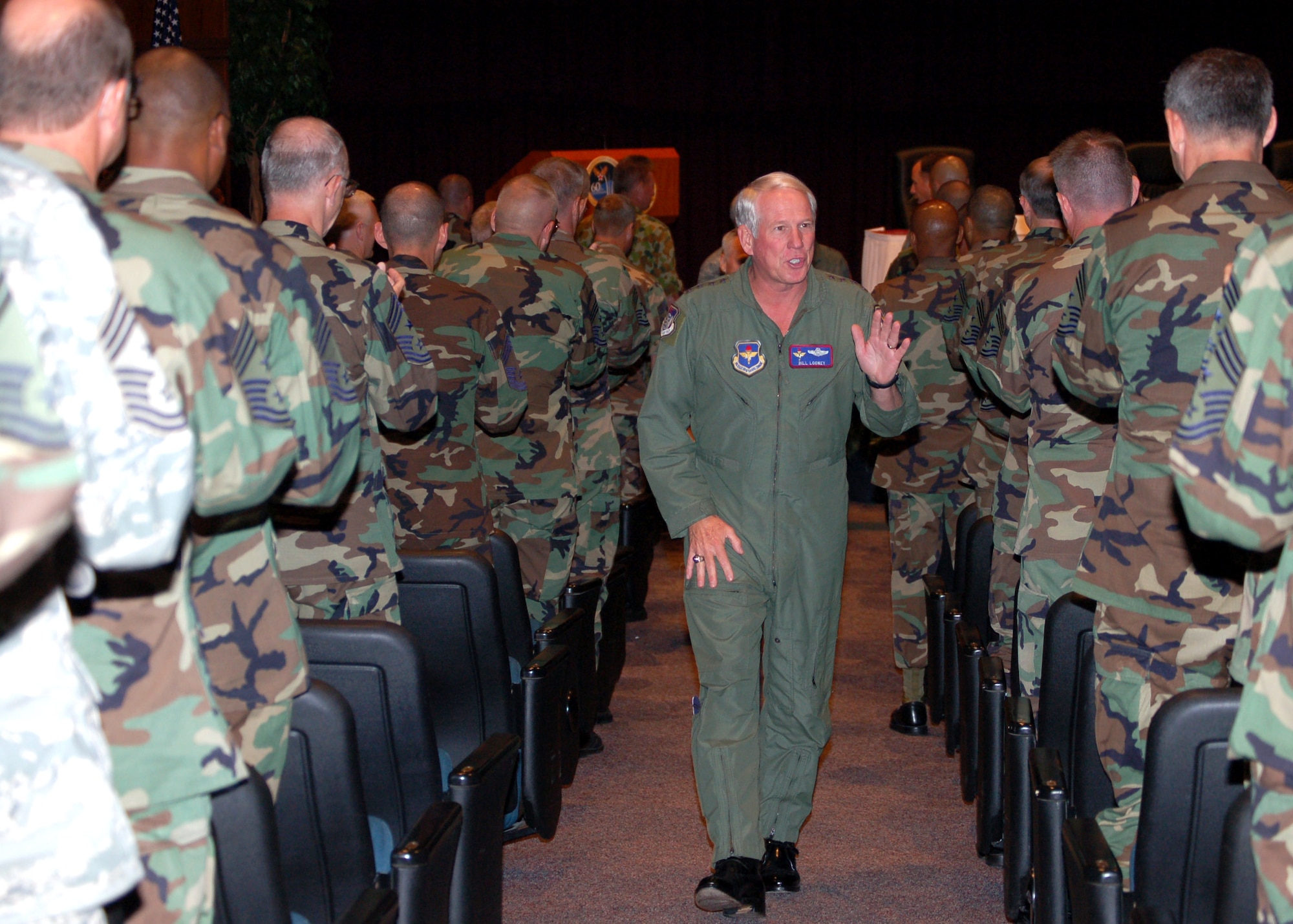 Gen. William R. Looney III departs the Air Force Senior NCO Academy Auditorium July 26 after participating in a Major Command Commander's Panel during the Senior Enlisted Leader Conference at Maxwell Air Force Base's Gunter Annex, Ala. General Looney is the Air Education and Training Command commander. (U.S. Air Force photo/Master Sgt. Lee Roberts) 

