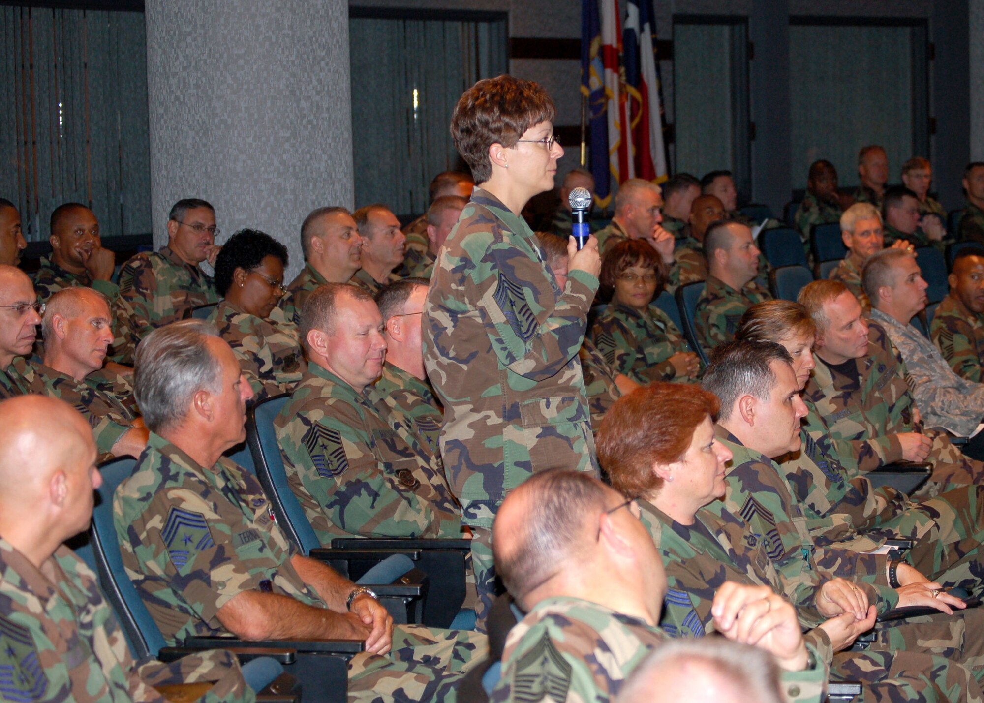 Chief Master Sgt. Judy Ruiz poses a question July 26 to the Chief Master Sergeant of the Air Force Panel at the Air Force Senior NCO Academy during the Senior Leader Summit at Maxwell Air Force Base's Gunter Annex; Ala. Chief Ruiz is the command chief for the 377th Air Base Wing at Kirtland AFB, N.M. (U.S. Air Force photo/Master Sgt. Lee Roberts) 
