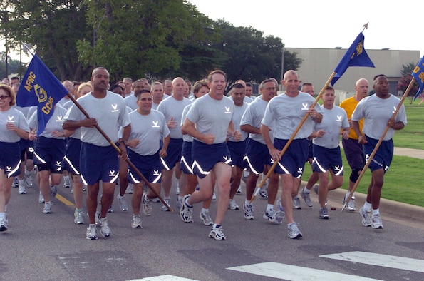 Chief Master Sgt. Lesley Morrissette, 94th Airlift Wing Command Chief (left), proudly bears the guidon of the Air Force Reserve Command's command chief master sergeants while running next to Chief Master Sgt. of the Air Force Rodney J. McKinley during the Senior Enlisted Summit chief's run on July 22, at Maxwell-Gunter Air Force Base, Ala. Chief McKinley and other senior enlisted leaders arrived for the start of the summit held at nearby Gunter Annex, Ala. "We're eager to begin the summit," Chief McKinley said.  "The Air Force is currently capitalizing on many opportunities and faces several challenges the senior enlisted leaders gathering here are uniquely qualified to address.  I'm looking forward to the information, dialogue and ideas we'll be sharing."  The summit kicked off July 22 with a day of physical and athletic conditioning and continued through July 27. (U.S. Air Force photo/Master Sgt. Stan Coleman)