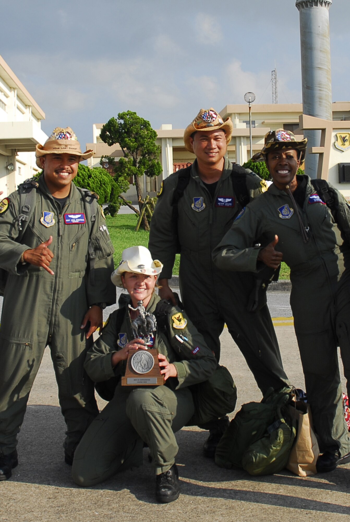 From left:  Staff Sgt. Paul deGuzman, Staff Sgt. Erin Rieffer, Capt. Arthur Ascano, and Maj. Mattie Goode, pose at Kadena Air Base, Japan, July 29, 2007, with the trophy they received for winning the Best Aeromedical Evacuation Configuration Crew Award during the 2007 Air Mobility Command Rodeo competition held at McChord Air Force Base, Wash., July 23 - 27, 2007. The AMC Rodeo is a readiness competition pitting U.S. and international mobility units against each other. All are assigned to the 18th Aeromedical Evacuation Squadron. (U.S. Air Force/ Airman 1st Class Sheila deVera)