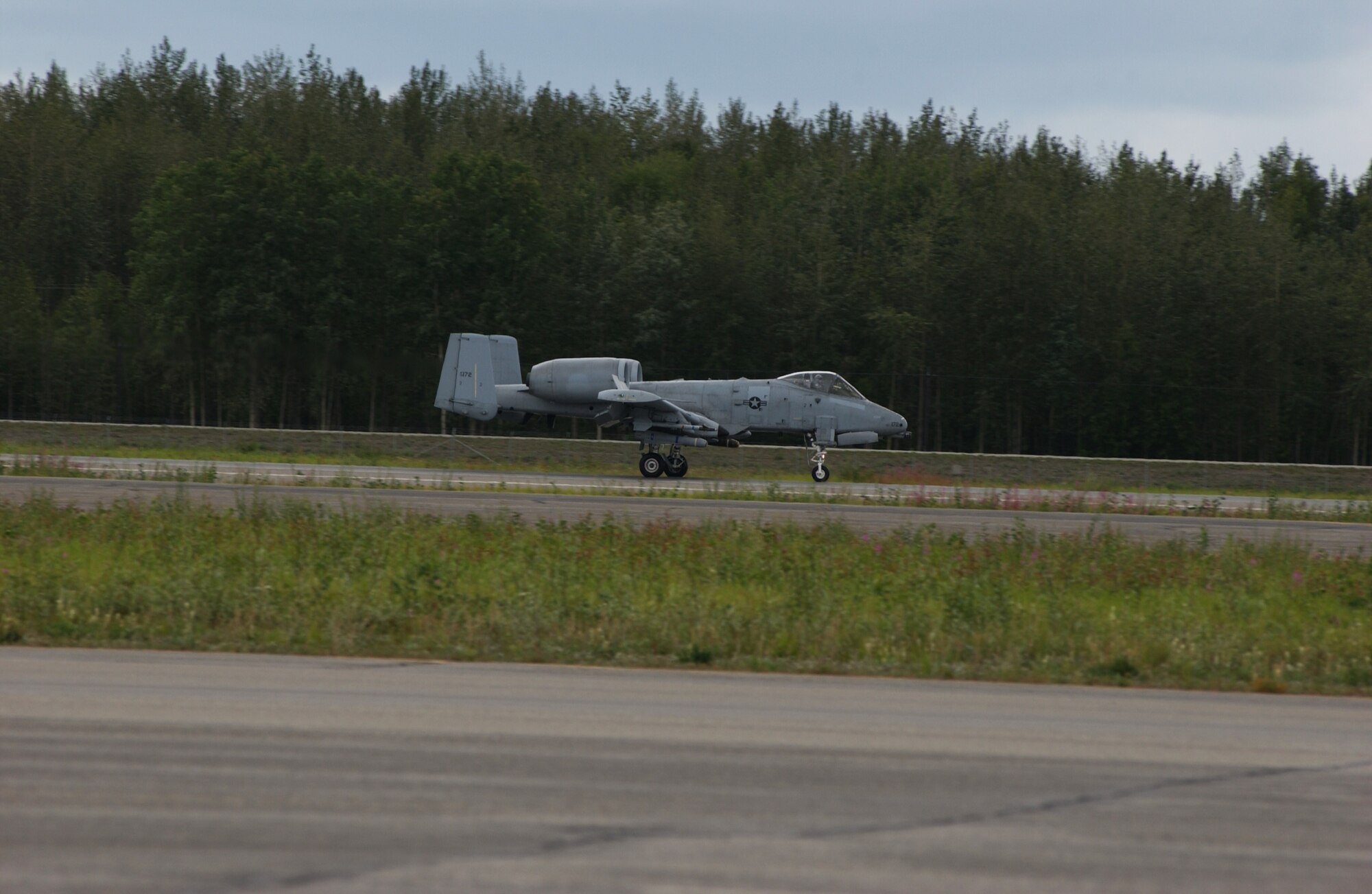 EIELSON AIR FORCE BASE, Alaska -- An A-10 Thunderbolt from the 355th Fighter Squadron lands after the last flight at Eielson AFB on July 31. The first two A-10's arrived at Eielson on December 18, 1981, while the last two A-10's are set to leave on August 15, 2007 to Moody AFB, Ga., and Mountain Home AFB, Idaho (U.S. Air Force Photo by Airman 1st Class Jonathan Snyder)