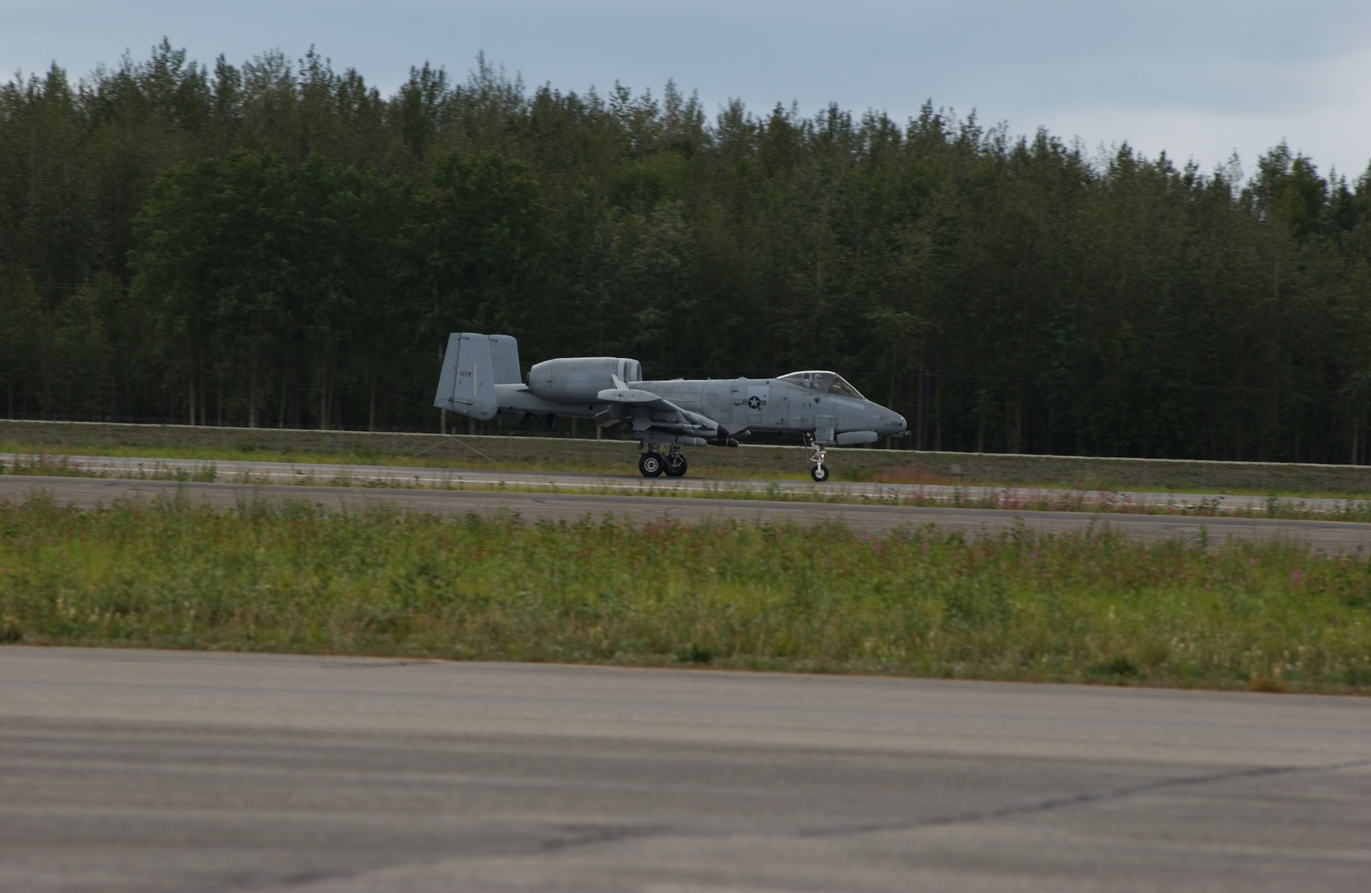 EIELSON AIR FORCE BASE, Alaska -- An A-10 Thunderbolt from the 355th Fighter Squadron lands after the last flight at Eielson AFB on July 31. The first two A-10's arrived at Eielson on December 18, 1981, while the last two A-10's are set to leave on August 15, 2007 to Moody AFB, Ga., and Mountain Home AFB, Idaho (U.S. Air Force Photo by Airman 1st Class Jonathan Snyder)