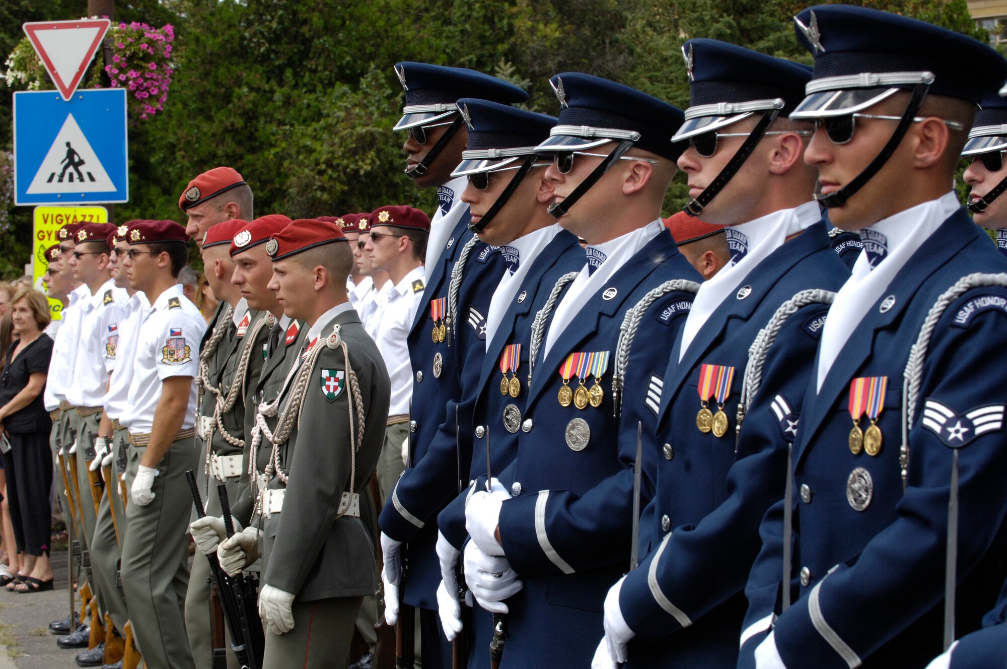 Members of the U.S. Air Force Honor Guard Drill Team stand next to armed forces representing the countries of Austria and the Czech Republic.  The Drill Team joined other countries and represented the U.S. armed forces at the REGIMENTFEST in Szerenes, Hungary 28 July, 2007.  The Drill Team, the traveling component of the Air Force Honor Guard, is touring five US installations across three countries throughout central Europe this week. The Drill Team tours U.S. Air Force bases/events world wide showcasing the precision of the U.S. Air Force to recruit, retain and inspire Airmen for the U.S. Air Force mission. (U.S. Air Force Photo by Senior Airman Daniel R. DeCook)(Released)
