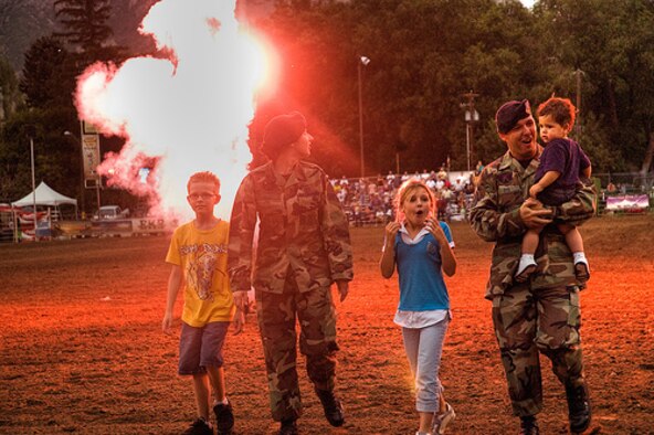 OGDEN, Utah-- Staff Sgt. Jeff and Senior Airman Christina Dye, both from the 75th Security Forces Squadron from Hill AFB, and their children where honored on July 24 during the Ogden Pioneer Days Rodeo.  (U.S. Air Force courtesy photo)