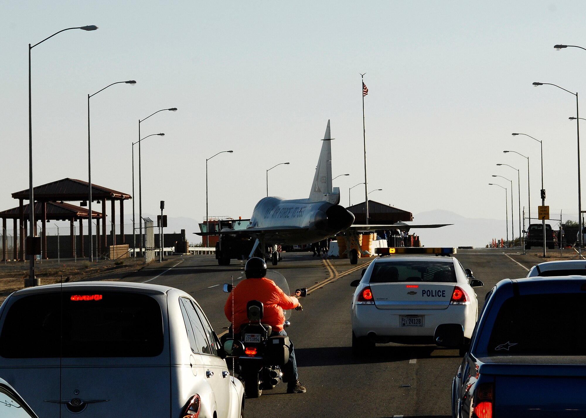 Edwards motorists wait at the West Gate during the transportation of an F-102 Delta Dagger to the Century Circle display outside the gate July 24. The display is scheduled to open in late August. Century Circle will feature Century Series aircraft and the old Edwards Control Tower. (Photo by Jim Shryne)