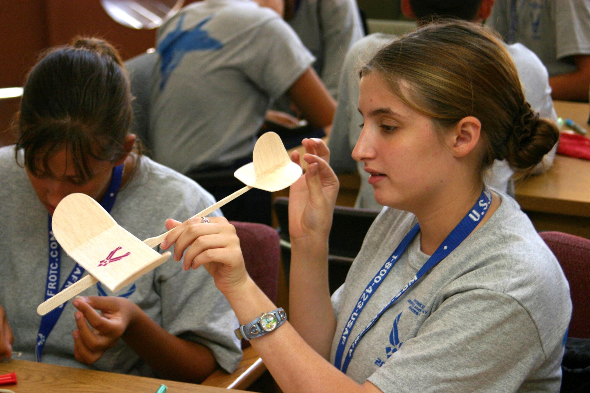 Air Force Junior ROTC Cadet Mylinda Winton looks over her nearly finished glider July 23 during a construction contest for the Junior ROTC Aerospace and Technology Honor Camp at the University of New Mexico in Albuquerque.  Cadets from Junior ROTC units worldwide visited various science and technology centers as part of the 2007 Air Force Junior ROTC Aerospace and Technology Honor Camps. Approximately 450 cadets attended one of eight camps this year in New Mexico and Oklahoma.  Currently, there are more than 100,000 cadets in the Air Force Junior ROTC program worldwide. (U.S. Air Force photo/Staff Sgt. Jason Lake) 