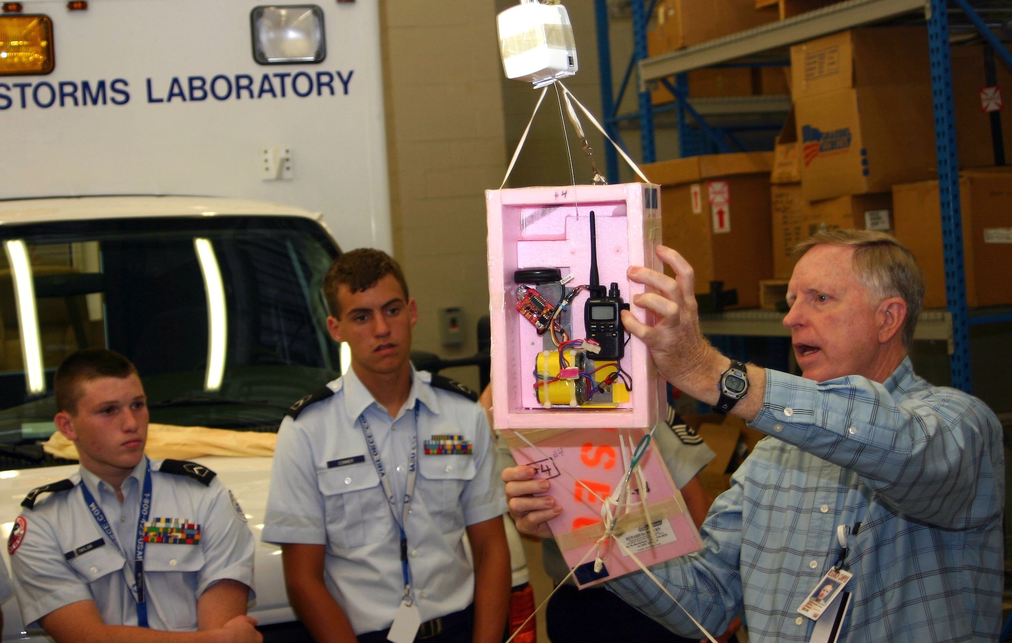 Air Force Junior ROTC cadets Wrenn Taylor and Jake Conner listen as Dr. W. David Rust of the National Oceanic and Atmospheric Administration demonstrates how a weather balloon collects atmospheric data and relays it back to the National Weather Service. Approximately 450 cadets from Air Force Junior ROTC units worldwide participated in the 2007 Air Force Junior ROTC Aerospace and Technology Camps during the last two months. The annual program, which featured eight camps in New Mexico and Oklahoma, aims to broaden the career goals and develop future leaders among America's Air Force Junior ROTC cadets. (U.S. Air Force photo/Staff Sgt. Jason Lake)