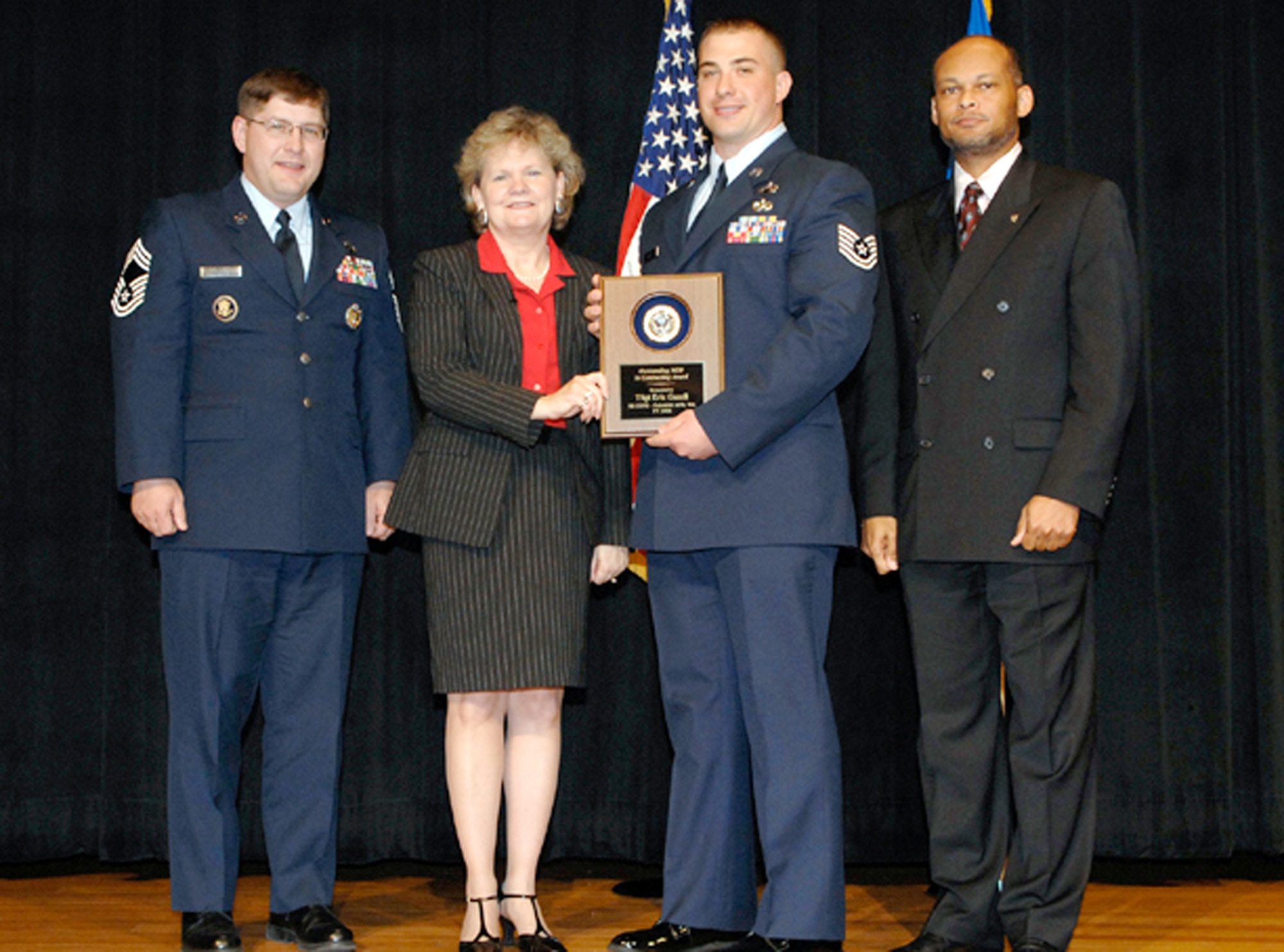 WASHINGTON – Tech. Sgt. Eric Gazell, 92nd Contracting Squadron contracting specialist, receives the Air Force Outstanding NCO in Contracting Award from the Assistant Secretary of the Air Force for Acquisition Sue Payton and the Deputy Assistant of Contracting Charlie Williams during an award ceremony at the Pentagon Auditorium in Washington D.C. Sergeant Gazell received the award for his exceptional performance at Fairchild and while deployed. (Courtesy photo)