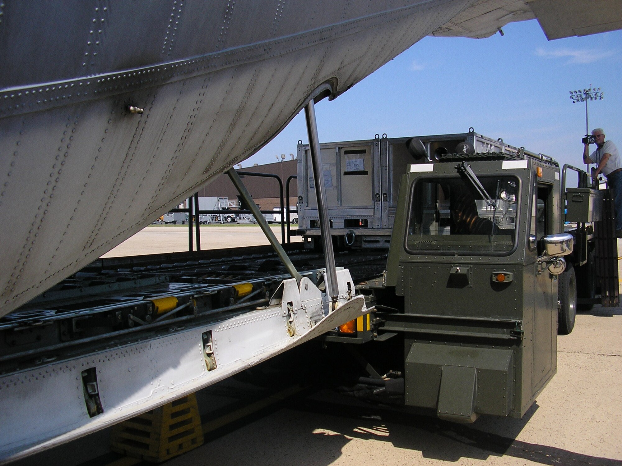 Airmen from the 305th Aerial Port Squadron at McGuire Air Force Base, N.J., received, prepared and loaded components of the joint modular intermodal distribution system as part of a joint capabilities technology demonstration by U.S. Transportation Command officials to find greater efficiencies in delivering cargo to the warfighter while reducing the risk servicemembers face on the road during conflict.  Cargo is being loaded on to a transport aircraft at McGuire AFB July 30 prior to being flown to an austere airstrip at Fort Irwin, Calif.   (Courtesy photo)