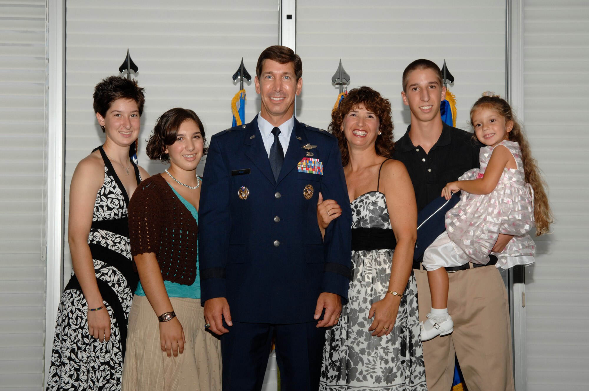 EGLIN AIR FORCE BASE; Fla. -- Nicole, Caity, Pam (wife), Kyle and Michaela all pose with their father and husband Brig. Gen. Joseph A. Lanni, Air Armament Center vice commander, during his promotion ceremony at the Officers' Club Aug. 27. More than 300 friends and family members joined the Lanni family to celebrate the achievement. (U.S. Air Force photo by Craig McDonnell)
