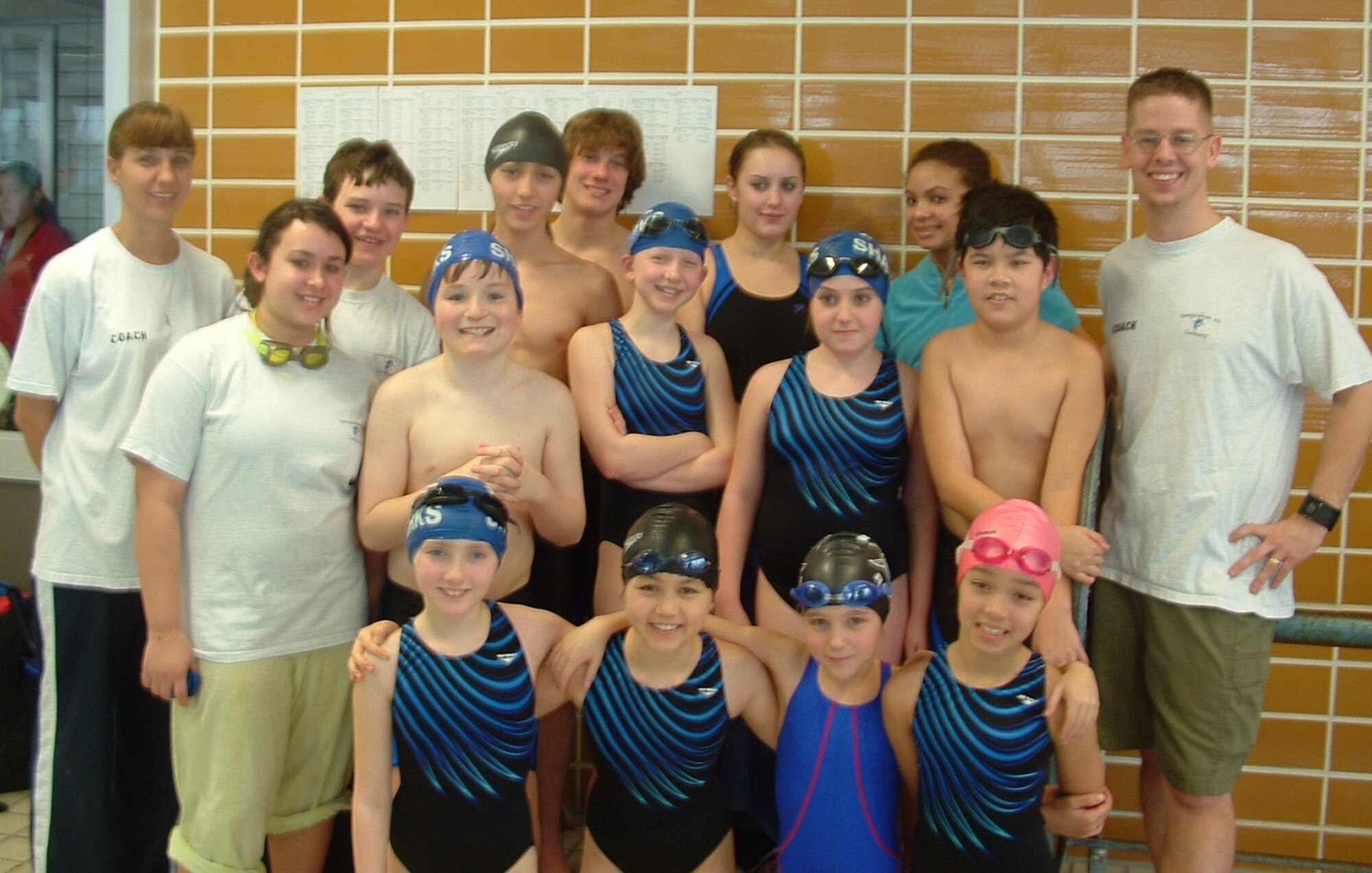 SPANGDAHLEM AIR BASE, Germany -- Members of the Eifel Sharks swim team take a moment to pose for a group photo at their Divisional Championships. The team has been around for 20 years and is a part of the European Forces Swim League. The Eifel Sharks swim team is looking for childe ages six to 18 who can swim 25 meters to join their ranks for the upcoming season. (Courtesy photo)
