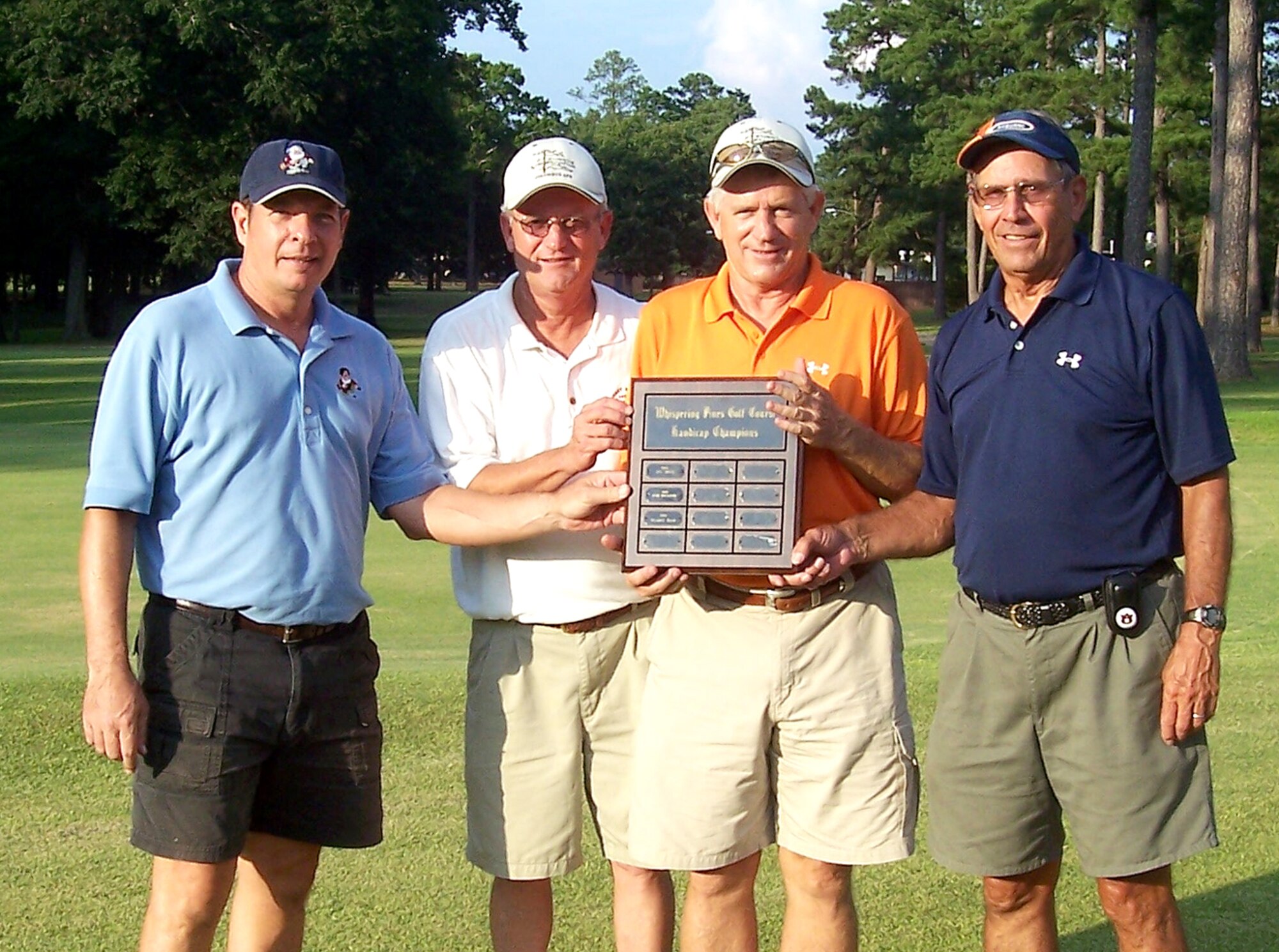 A LSI team made up of (left to right) Murray Woody, John Edens, Bob Le Tourneau and Jerry Hudson, won the Golf Intramural Championship July 24 at the Whispering Pines Golf Course. The Whispering Pines Golf Course offers scrambles every Thursdays at 4:45 p.m. Entry is $5 per person plus greens fees. All levels of golfers can enjoy this weekly 9-hole tournament. Call 434-7932 for more information. (U.S. Air Force Photo)
