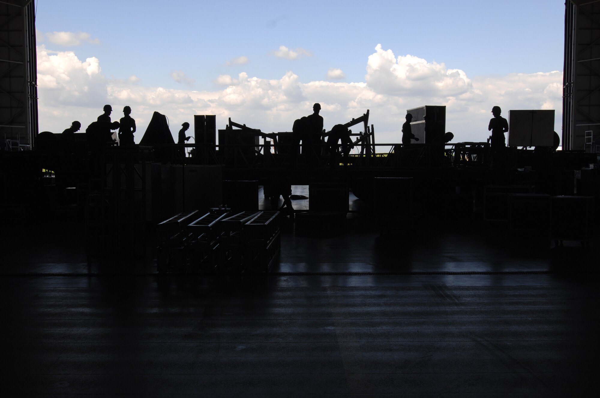 The day before every show the Tops In Blue performing team, with guidance from five technical personnel, sets up more than 54,000 pounds of staging, lighting, audio, and special effects equipment. The crew begins set-up for the RAF Mildenhall performance in hangar 814, July, 24, 2007. (U.S. Air Force photo by Tech. Sgt. Tracy L. DeMarco)