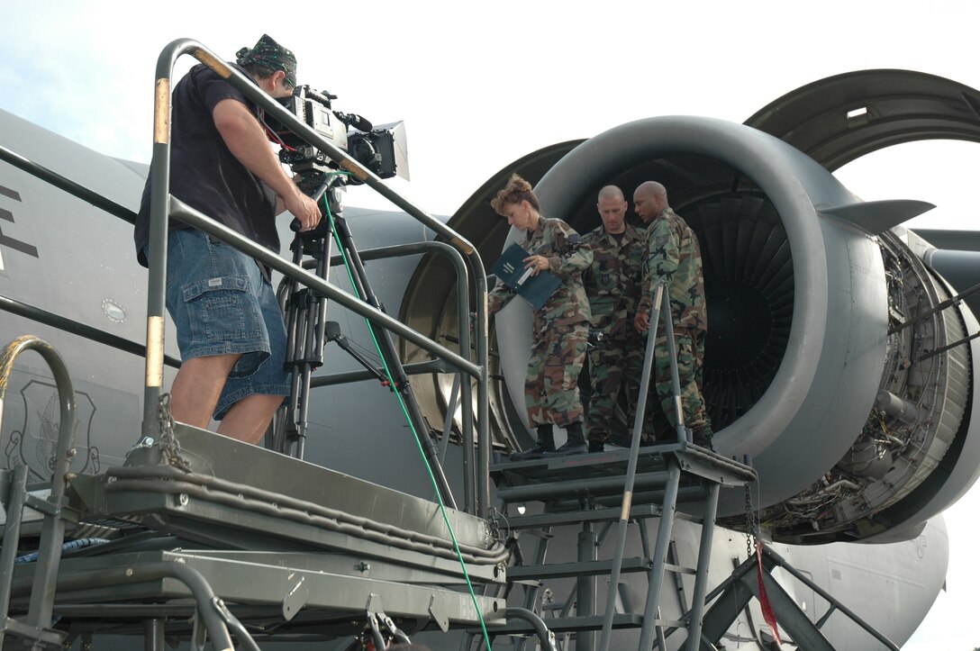 Crew chiefs from the 315th Airlift Wing, Charleston AFB, S.C., participate in the filming of the newest Air Force Reserve commercial.  (Photo by Staff Sgt. Jeff Kelly, USAFR)
