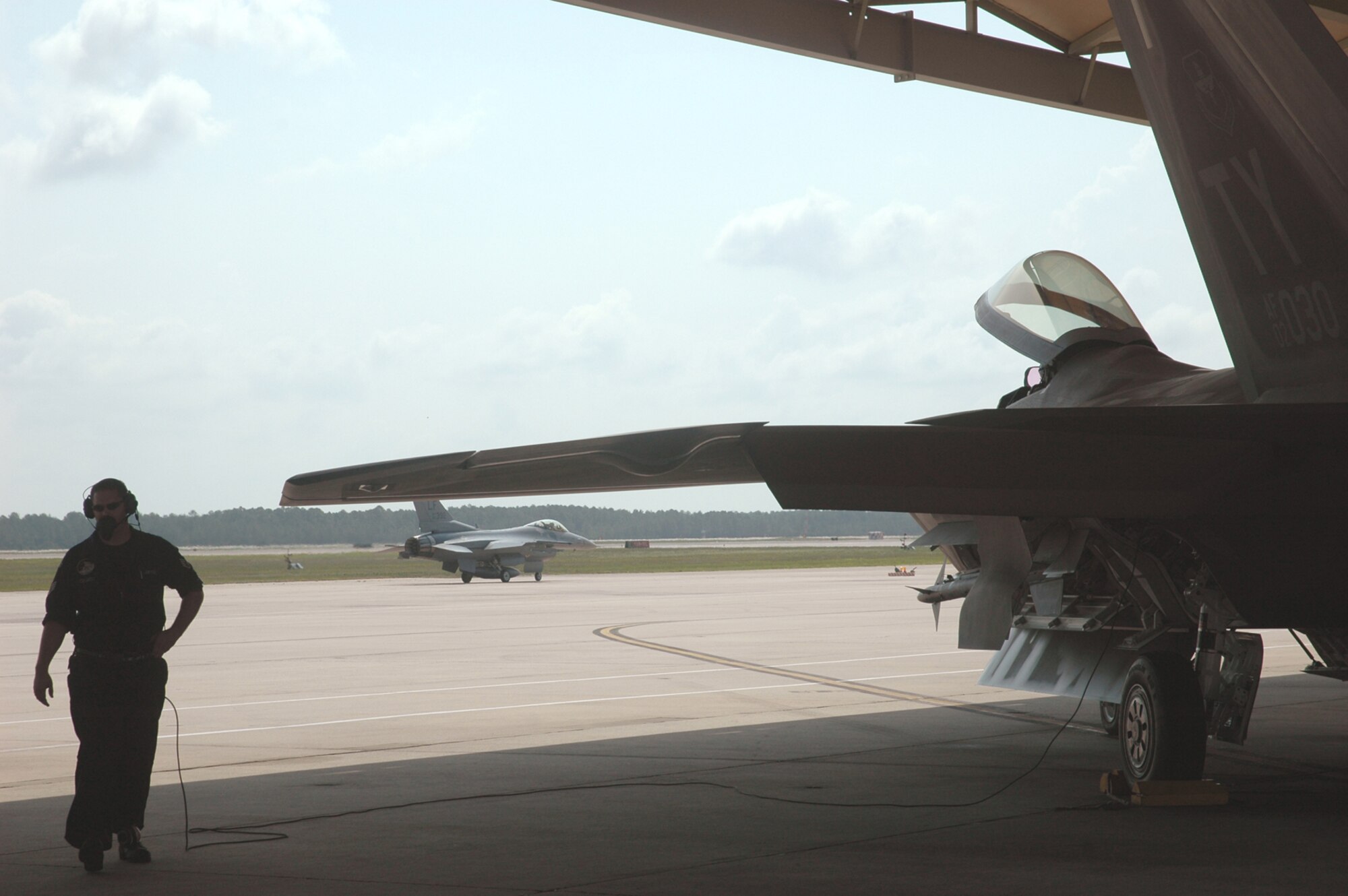 Staff Sgt. Steven Colwell, 43rd Aircraft Maintenance Unit crew chief, prepares to launch an F-22 Raptor during a training exercise against F-16s deployed from Luke AFB, Ariz. (U.S. Air Force photo/Staff Sgt. Vesta Anderson)