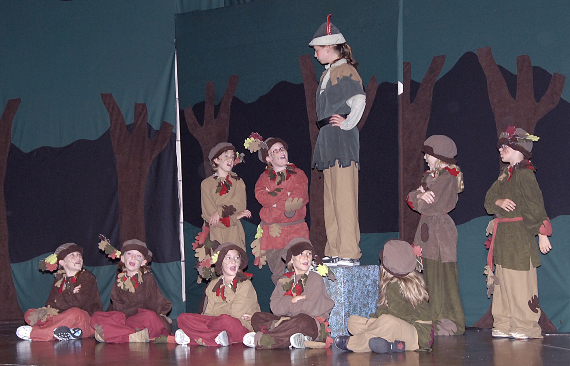Robin Hood, played by Emily Gilman, daughter of Tech Sgt. Paul Giman, 365 Training Squadron, addresses the foresters at the Missoula Children's Theater production of Robin Hood July 27 at the Community Activity Center. (U.S. Air Force photo/Harry Tonemah)
