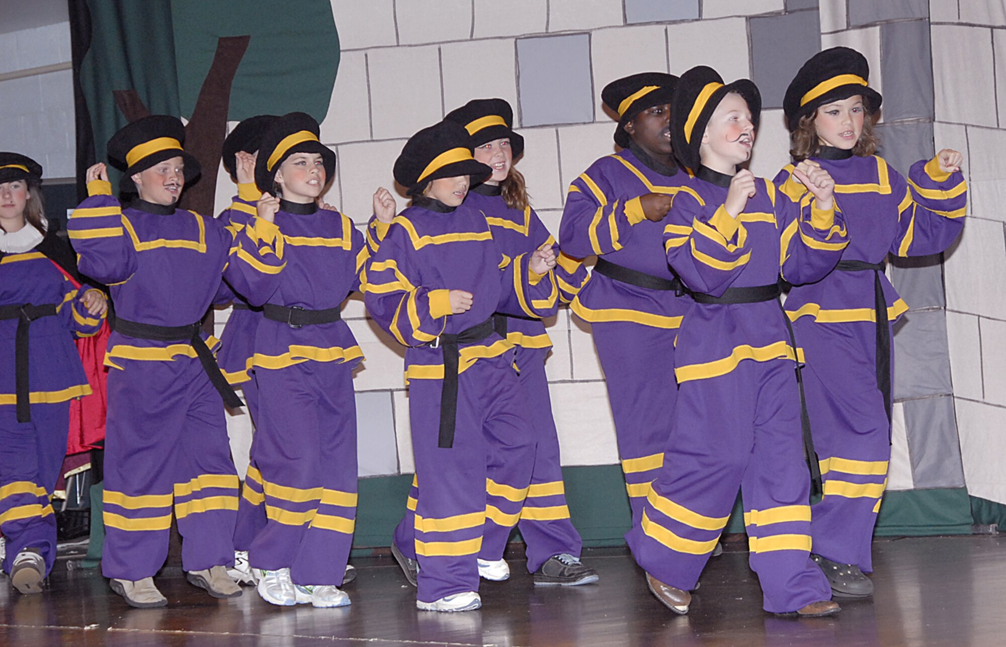 A group of royal guards marches across the stage during the Missoula Children's Theater production of Robin Hood July 27 at the Community Activity Center. (U.S. Air Force photo/Harry Tonemah)